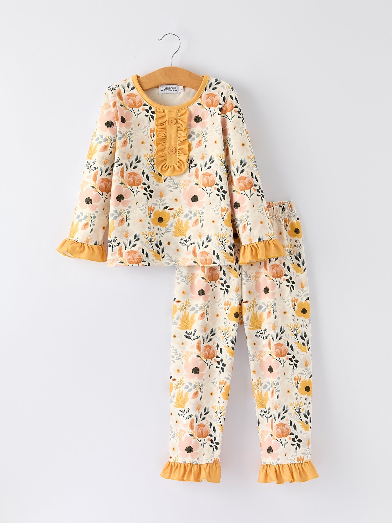 Girls two-piece pajama set with fall floral print and ruffle trim details