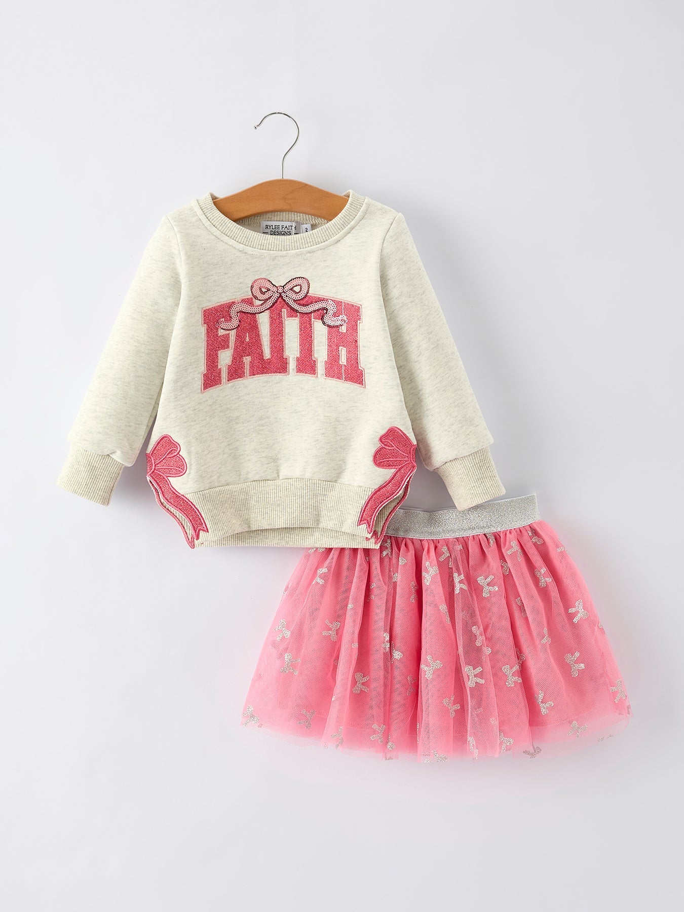 FAITH letter sweatshirt paired with a layered pink tulle skirt as a girls' two-piece fall outfit