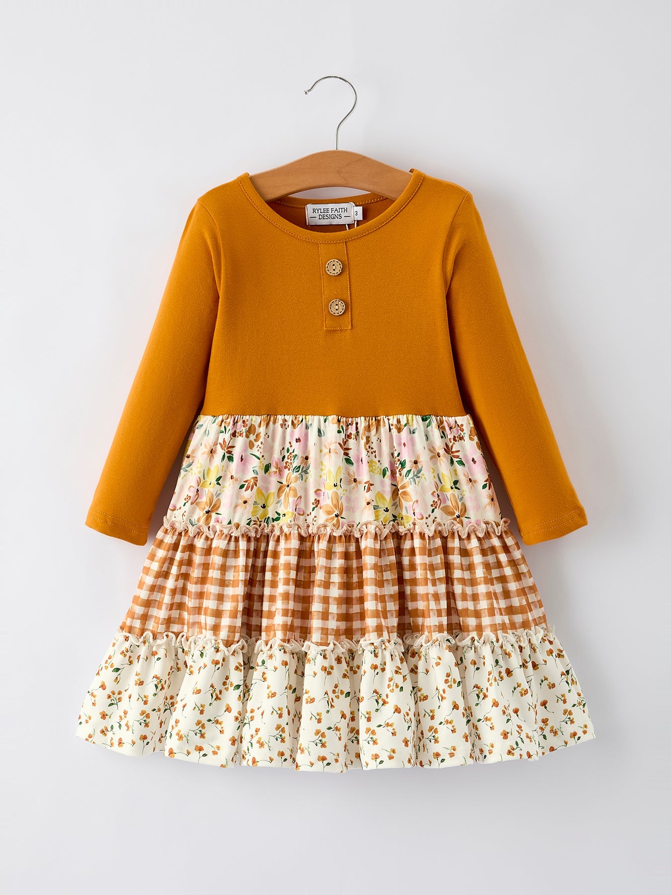 Long sleeve girls dress with patchwork of autumn florals and plaid patterns