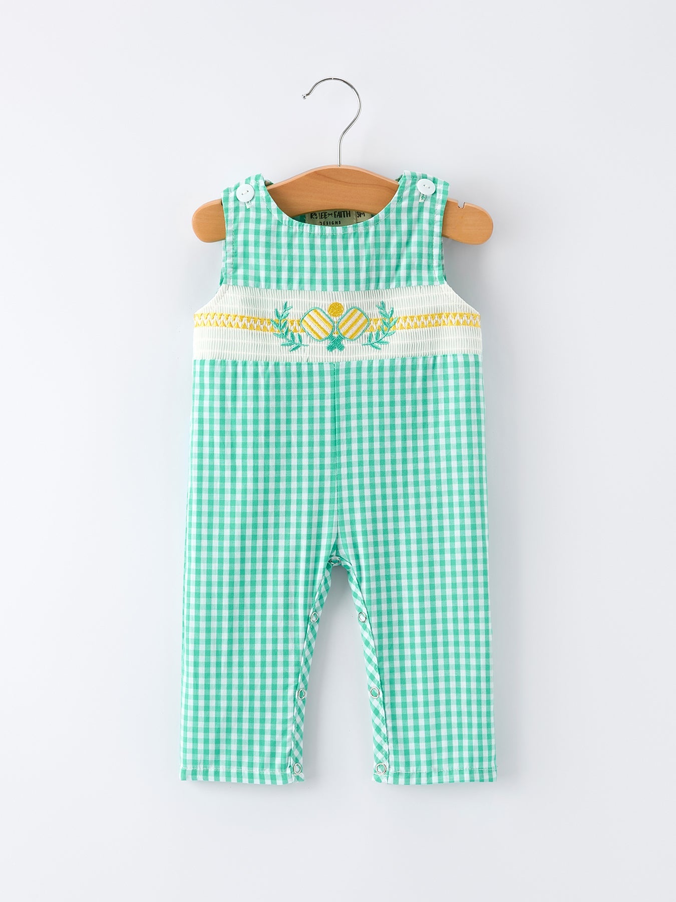 Green gingham baby boy romper with smocked chest and pickle ball embroidery, one-piece style with snaps