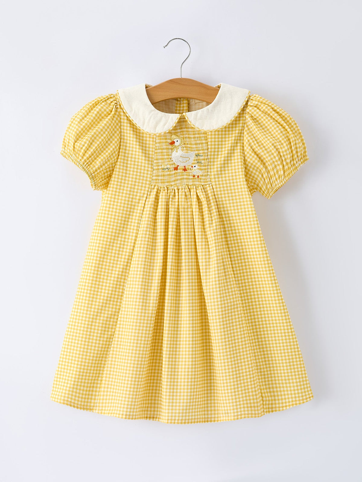 Rylee Faith Designs yellow goose embroidered smocked plaid dress for baby girls.