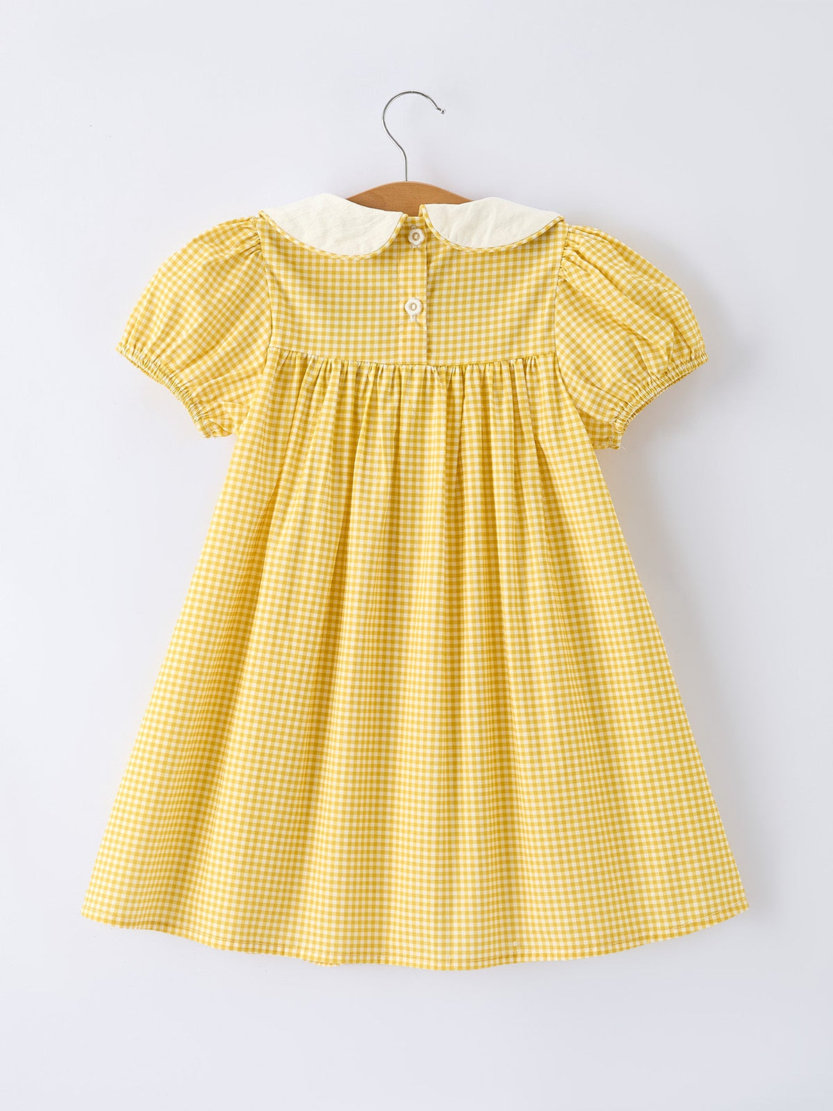 Rylee Faith Designs yellow goose embroidered smocked plaid dress.