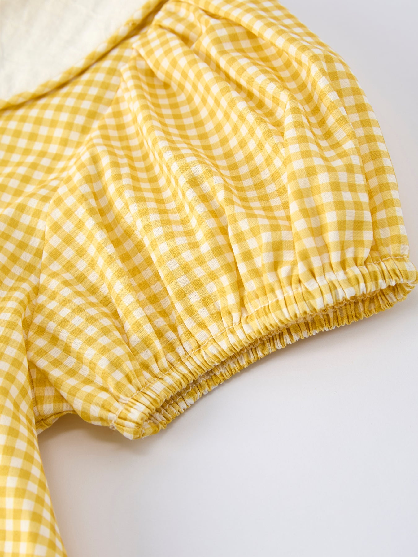 Rylee Faith Designs yellow goose embroidered smocked plaid dress