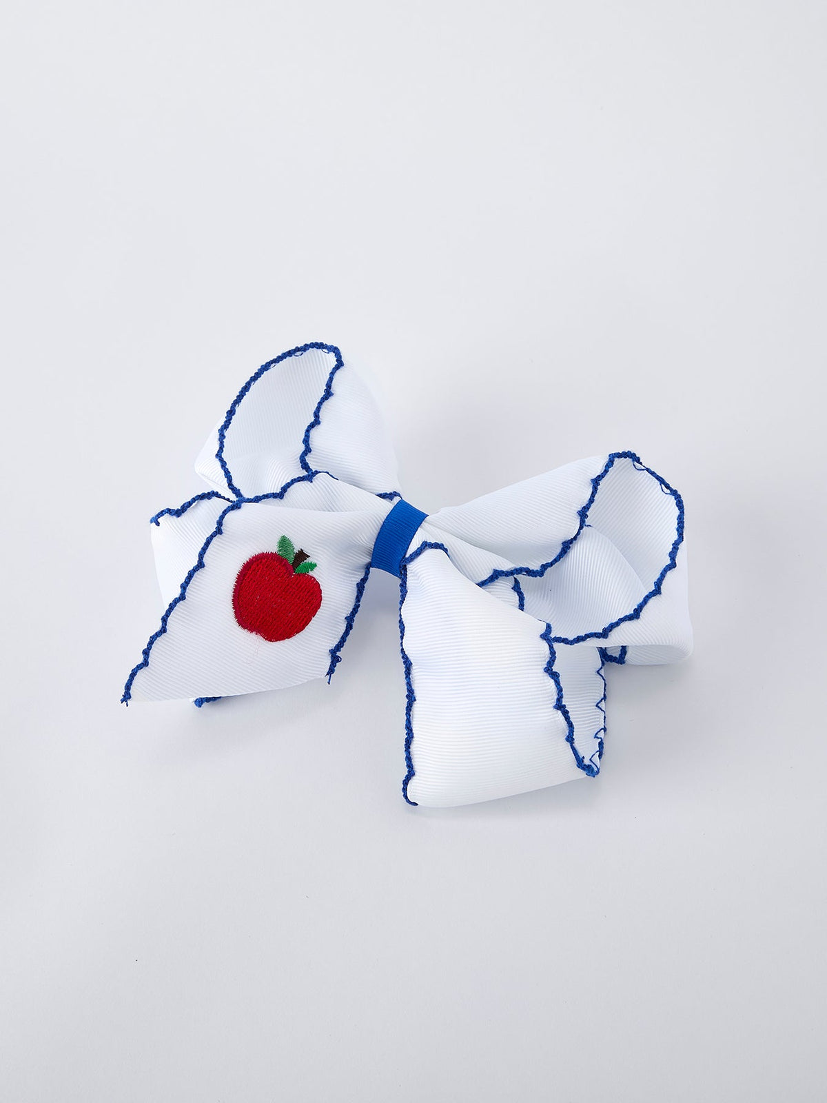 Rylee Faith Designs 6.25 inch red apple bow hair clip, a sweet back to school accessory.