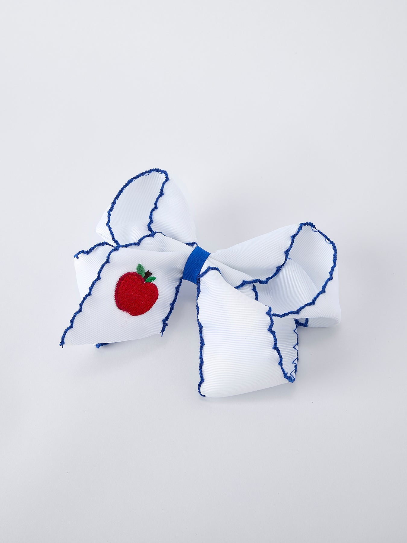 Rylee Faith Designs 6.25 inch red apple bow hair clip, a sweet back to school accessory.