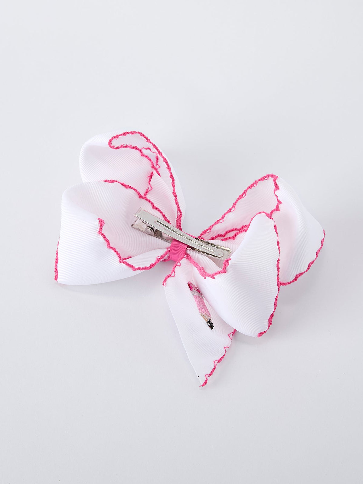 Rylee Faith Designs pink pencil bow hair clip for back to school.