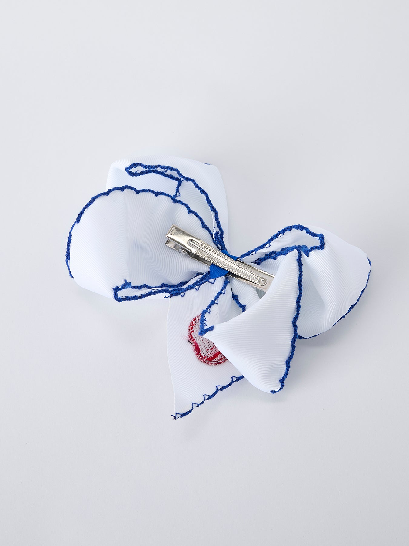 Rylee Faith Designs red apple bow hair clip for back to school.