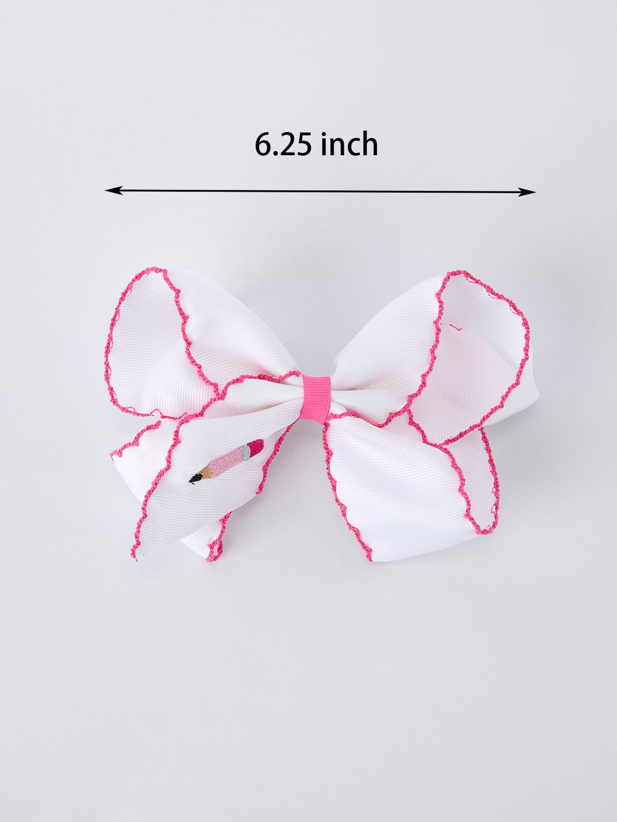 Rylee Faith Designs pink pencil bow hair clip for back to school.