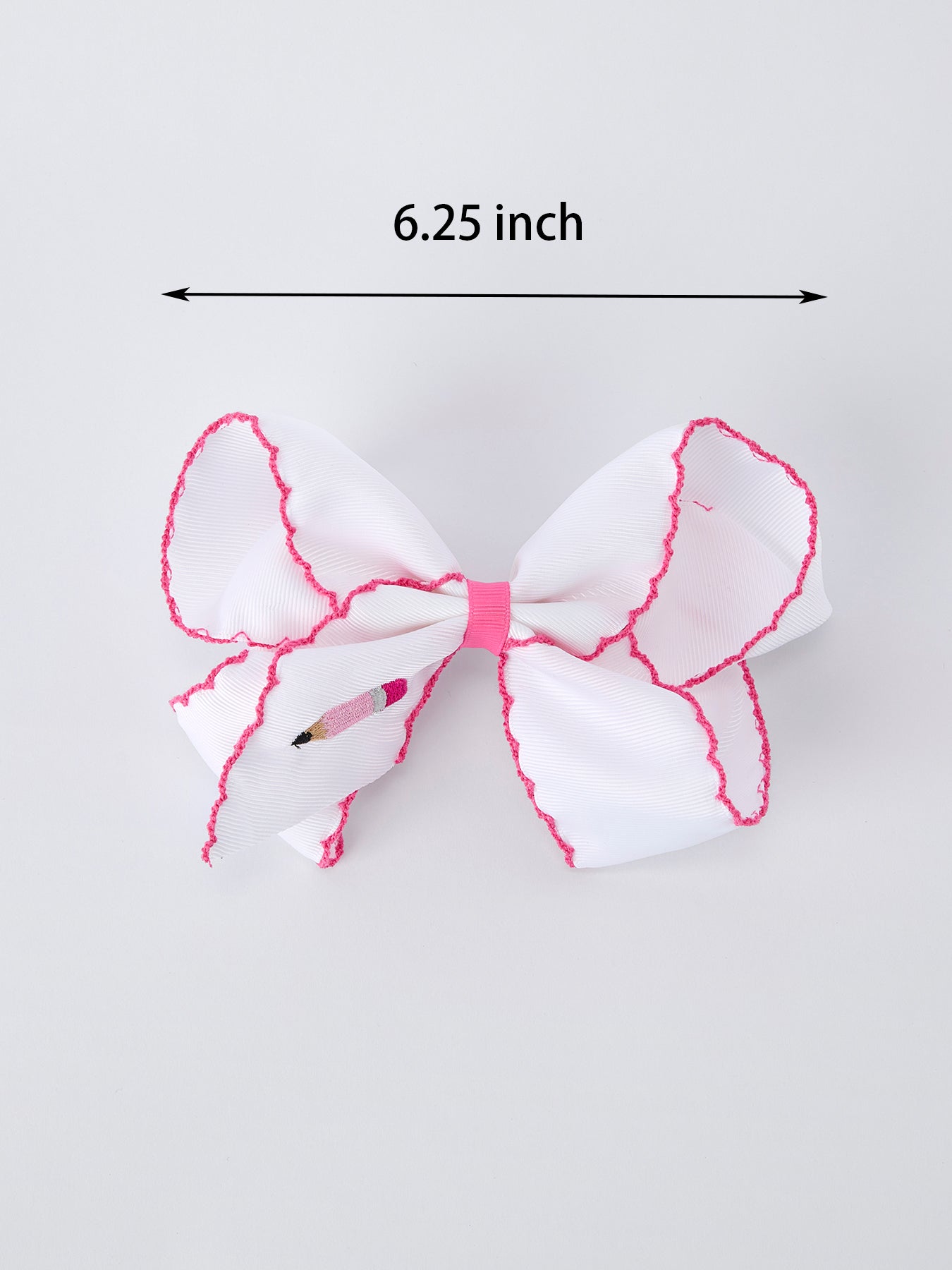 Rylee Faith Designs pink pencil bow hair clip for back to school.