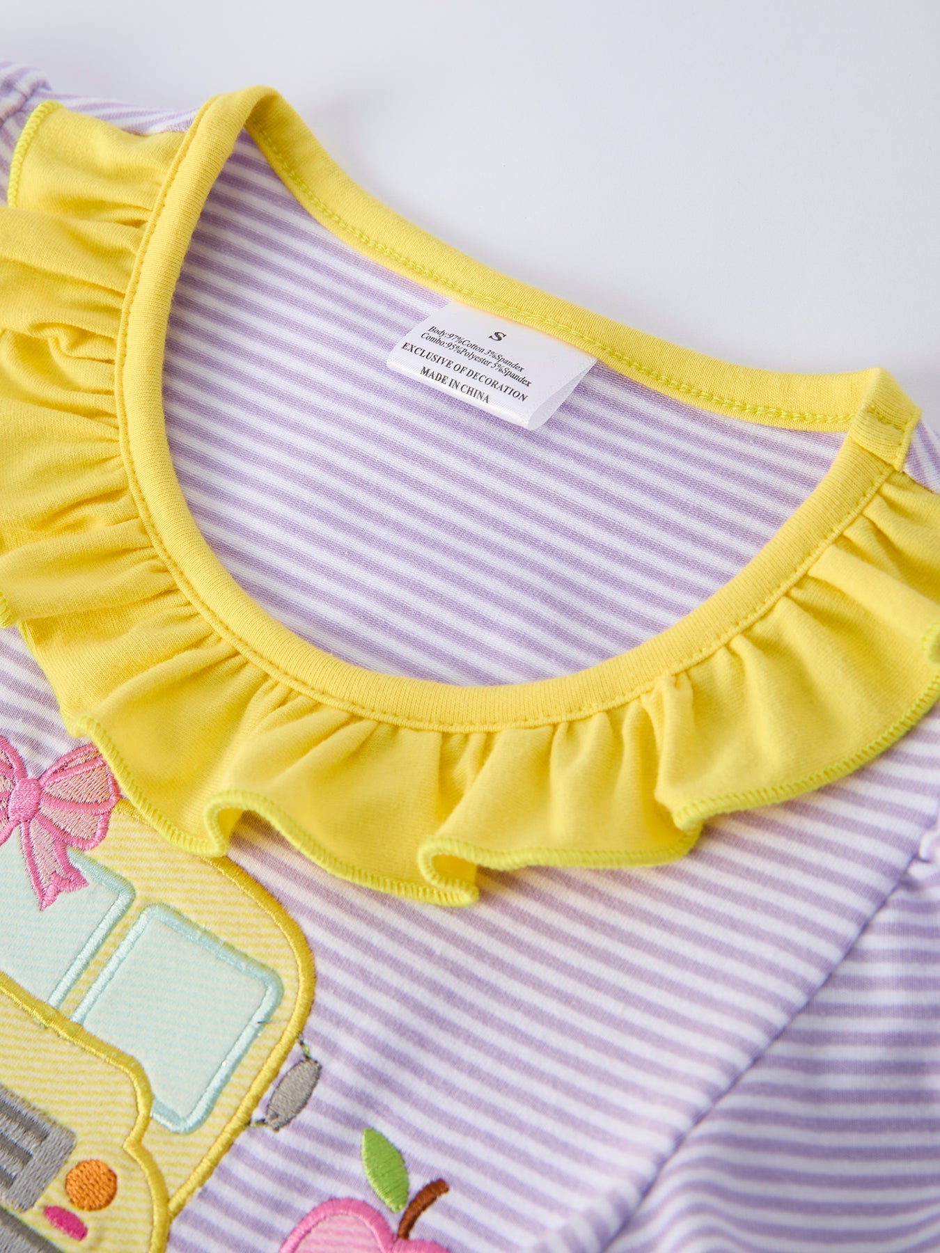 Rylee Faith Designs girls' back to school bus applique dress with ruffle pockets and short sleeves.