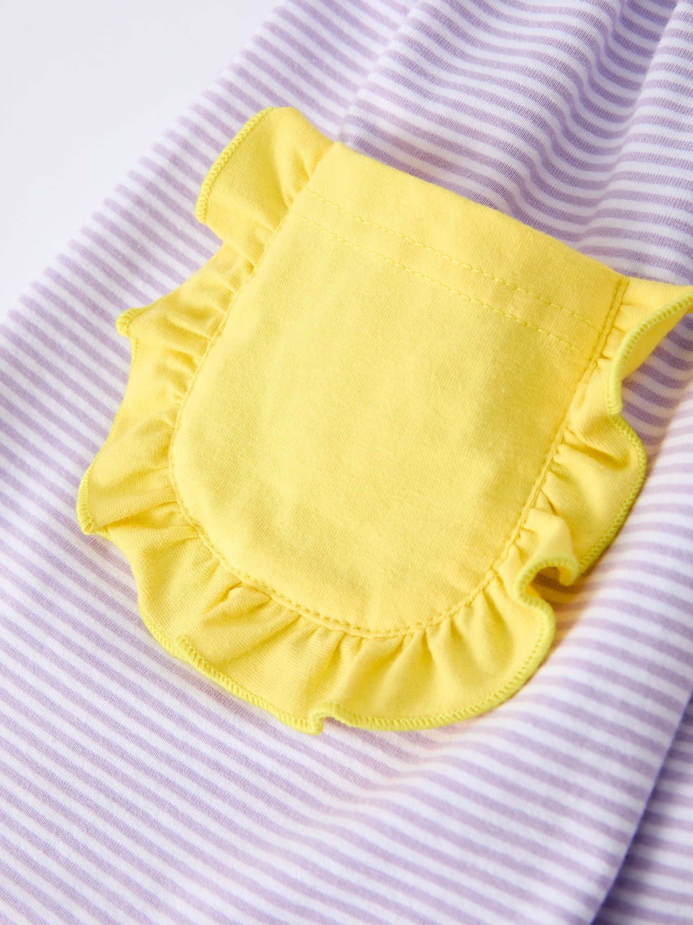 Rylee Faith Designs girls' back to school bus applique dress with ruffle pockets and short sleeves.