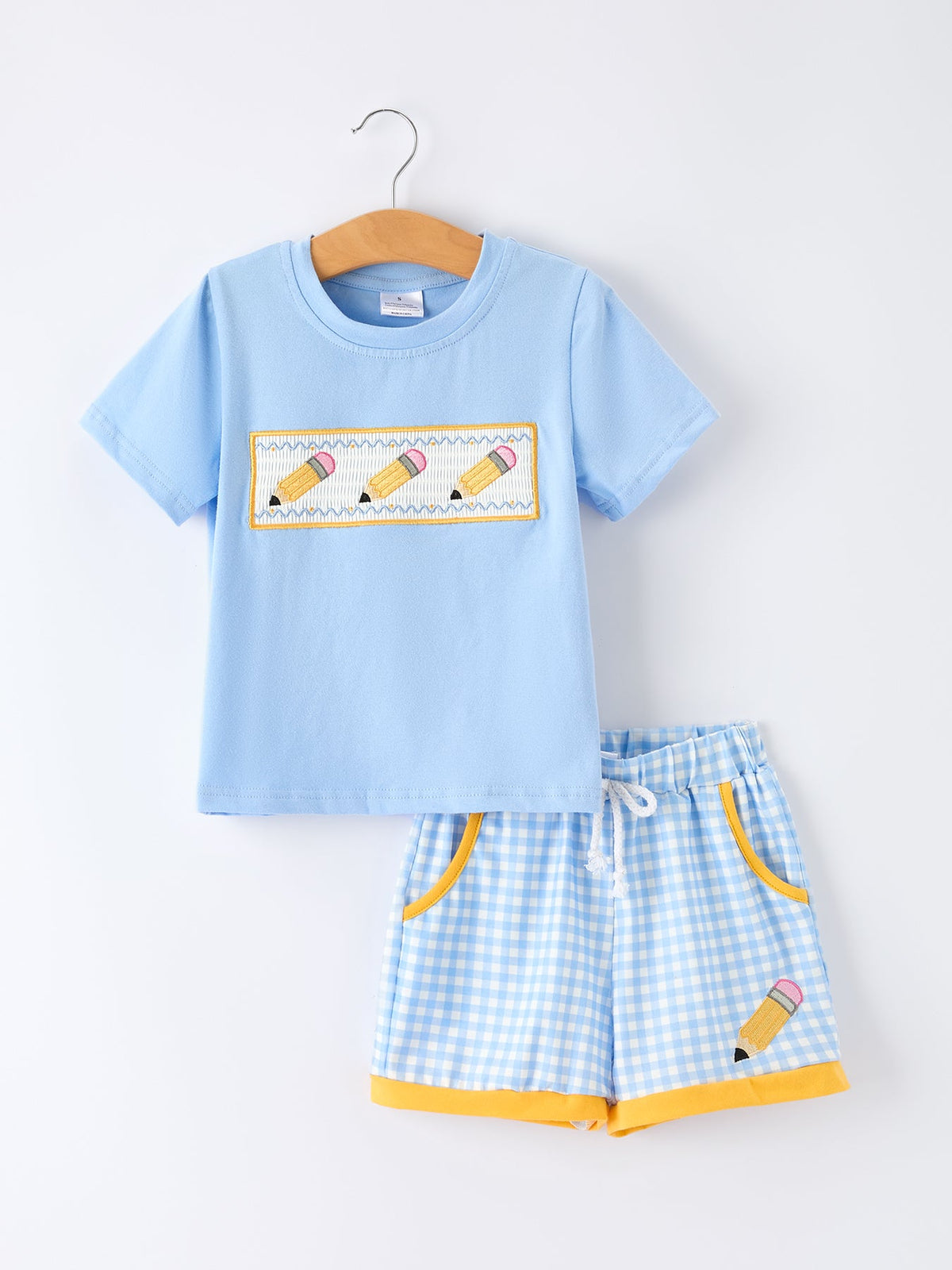 Rylee Faith Designs boys' back to school outfit with pencil applique t-shirt and plaid shorts.