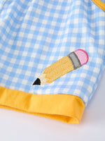 Rylee Faith Designs boys' back to school outfit with pencil applique t-shirt and plaid shorts.
