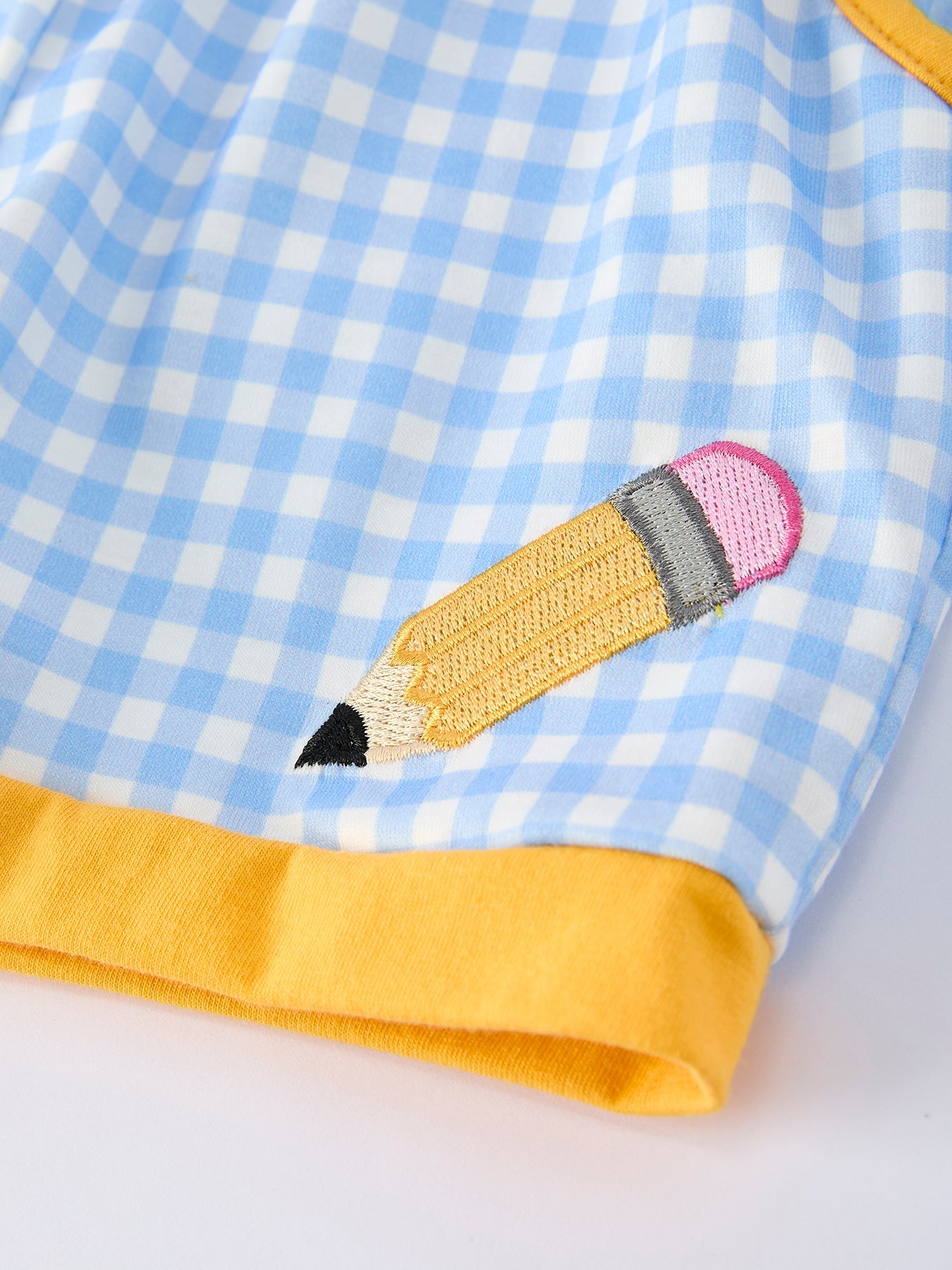 Rylee Faith Designs boys' back to school outfit with pencil applique t-shirt and plaid shorts.