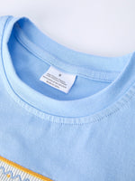 Rylee Faith Designs boys' back to school outfit with pencil applique t-shirt and plaid shorts.