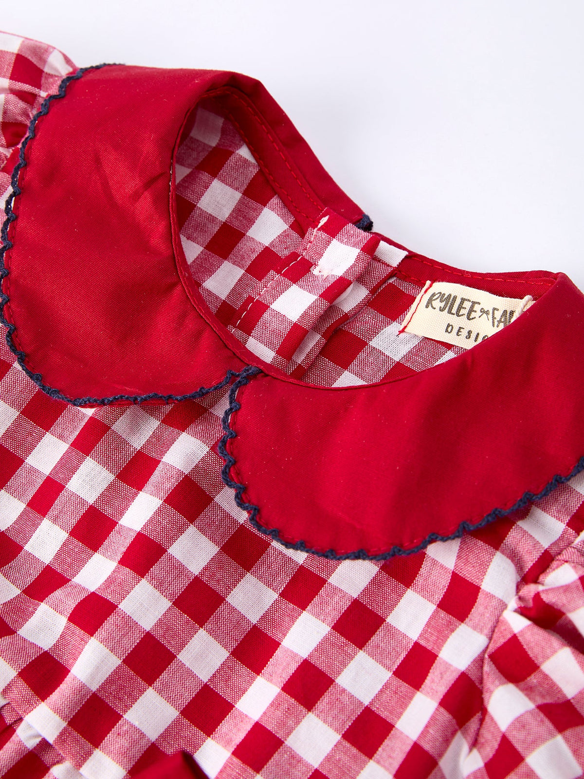 4th of July Flag Plaid Girl Peter Pan Collar Romper Bow by Rylee Faith Designs at Everetts Place