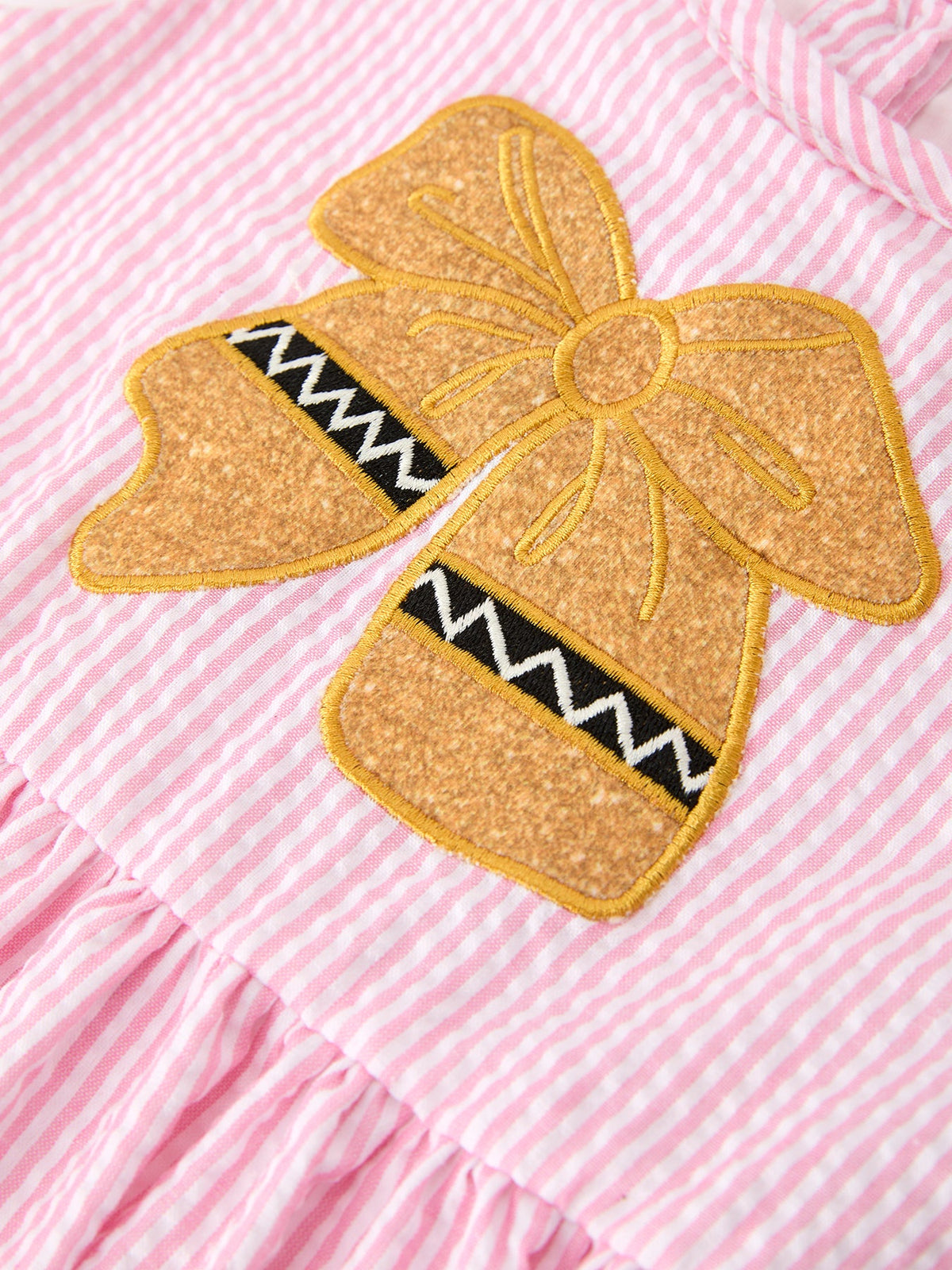 Rylee Faith Designs girls pink back to school bow twirl dress with ruffle applique.