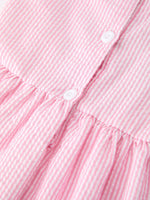 Rylee Faith Designs girls pink back to school bow twirl dress with ruffle applique.
