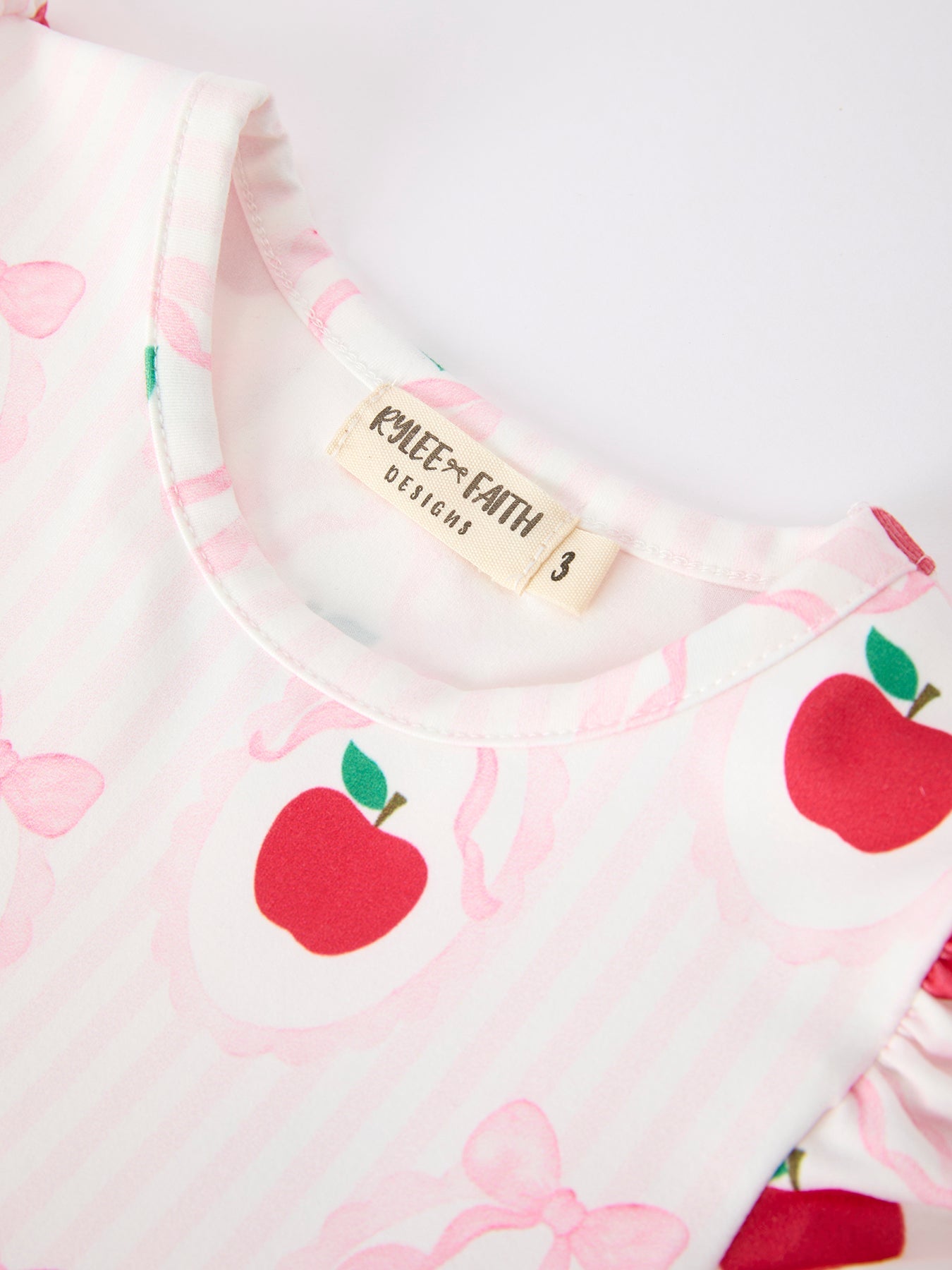 Rylee Faith Designs girls back to school apple bow pocket ruffle top shorts set