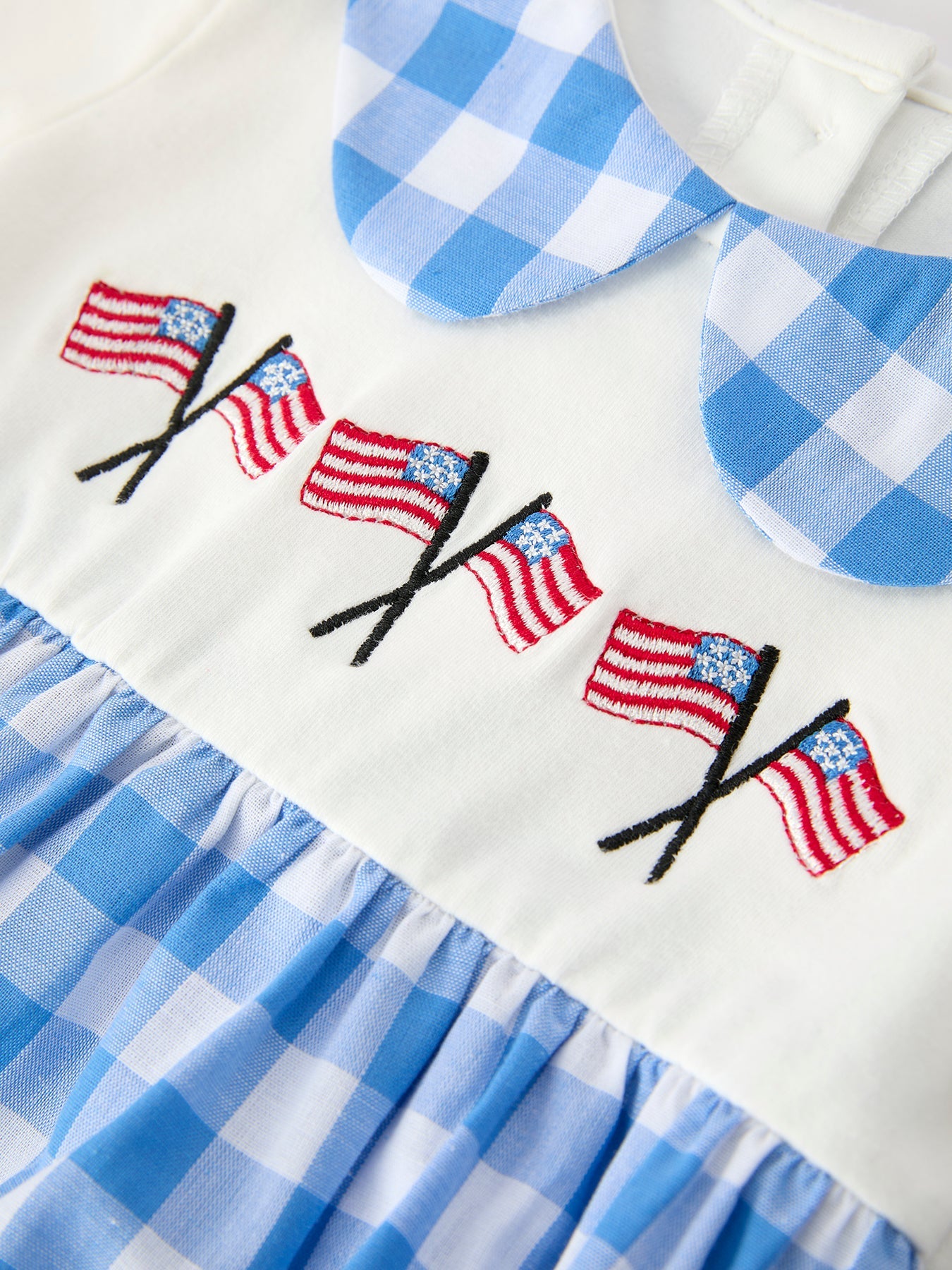 Rylee Faith Designs boys 4th of July plaid romper with embroidered petals collar.