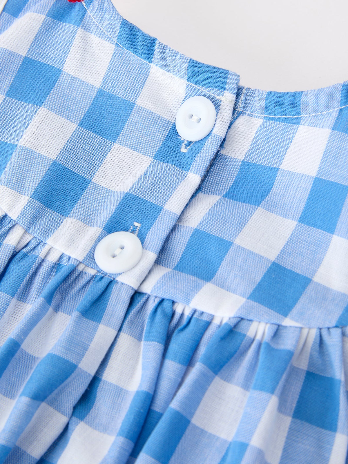 Girls 4th of July plaid romper with bow embroidery and petals collar by Rylee Faith Designs.