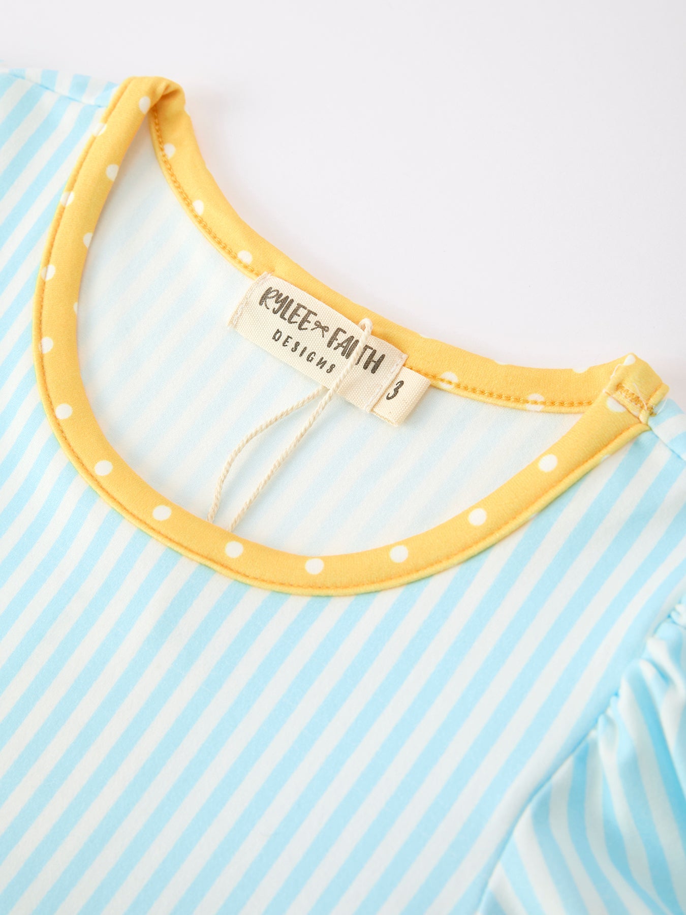 Girls Rylee Faith Back To School outfit: long-sleeve top with pencil applique, striped leggings, and pockets