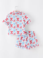 Rylee Faith Designs 4th of July girls pajamas: short sleeve, ruffle shorts, bow print.