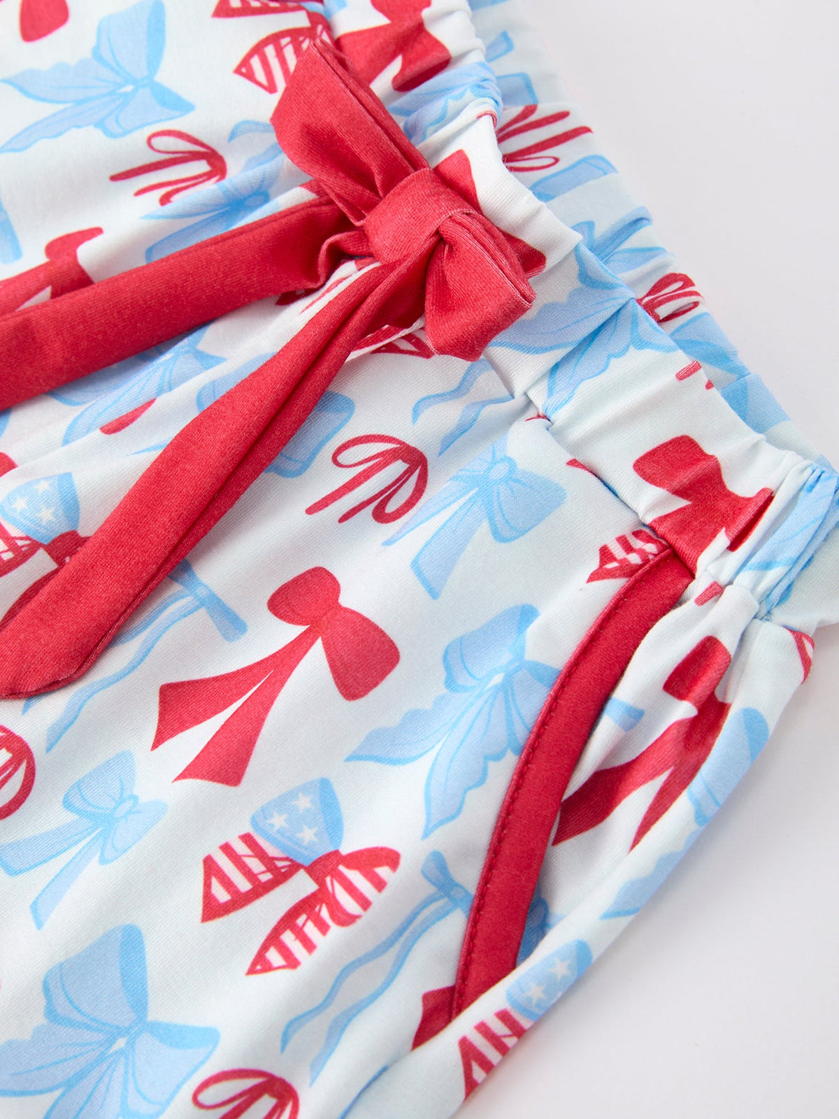 Rylee Faith Designs girls' 4th of July bow short sleeve pajama set with ruffle shorts.