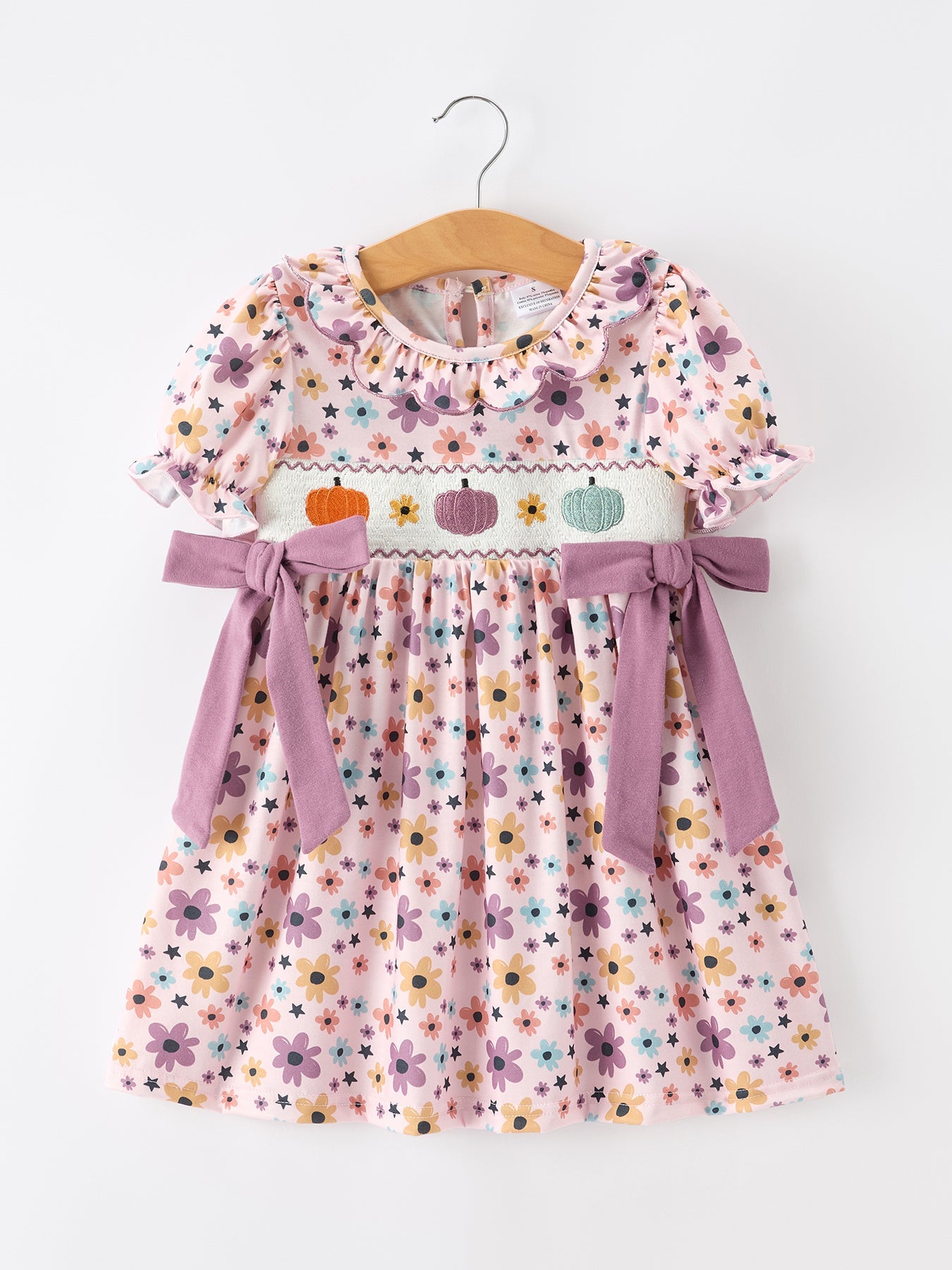 Girls dress with pastel pumpkin embroidery, colorful floral print, puff sleeves, and side bows