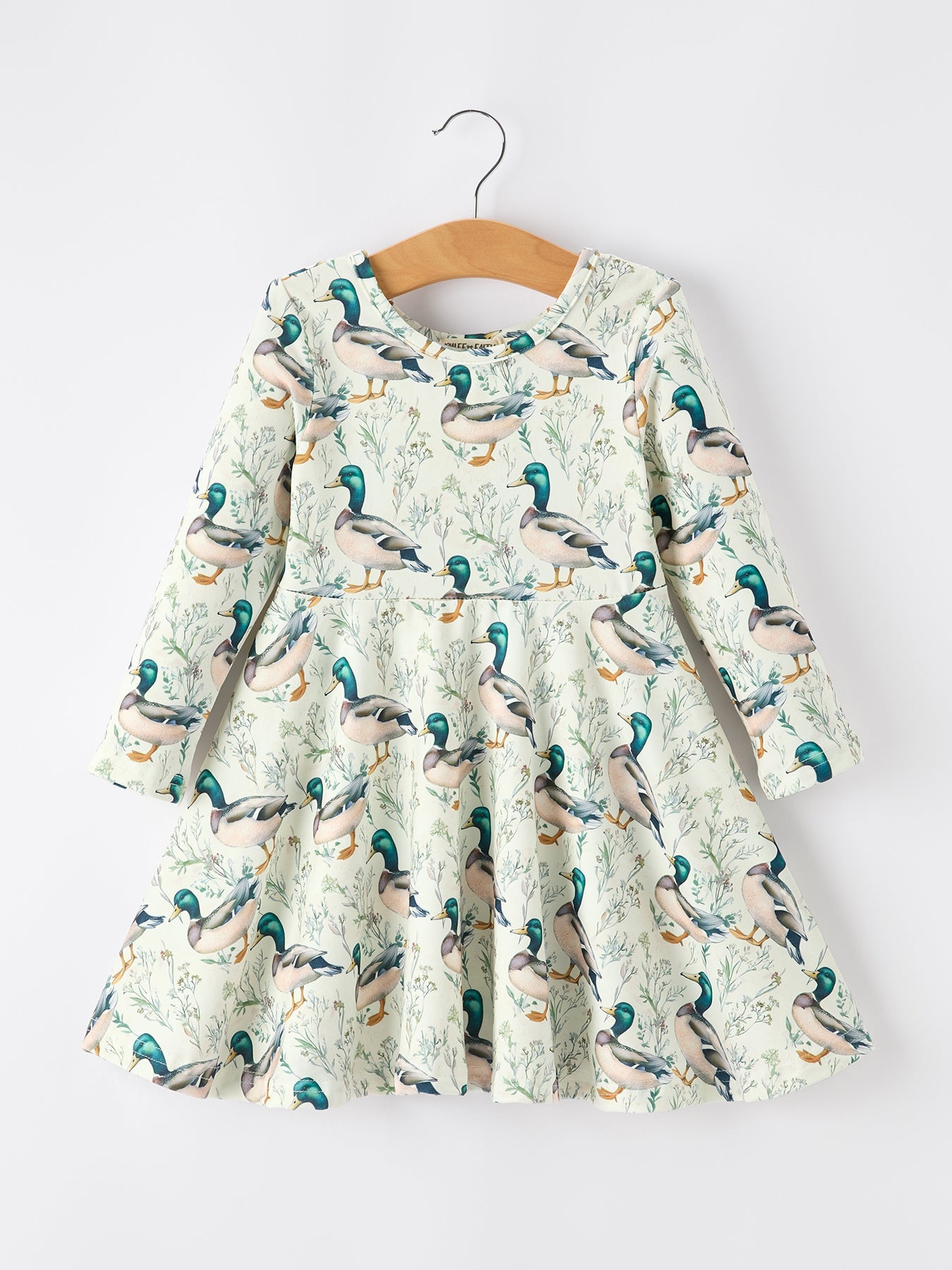 Long sleeve twirl dress with a duck print on a soft nature-inspired background.