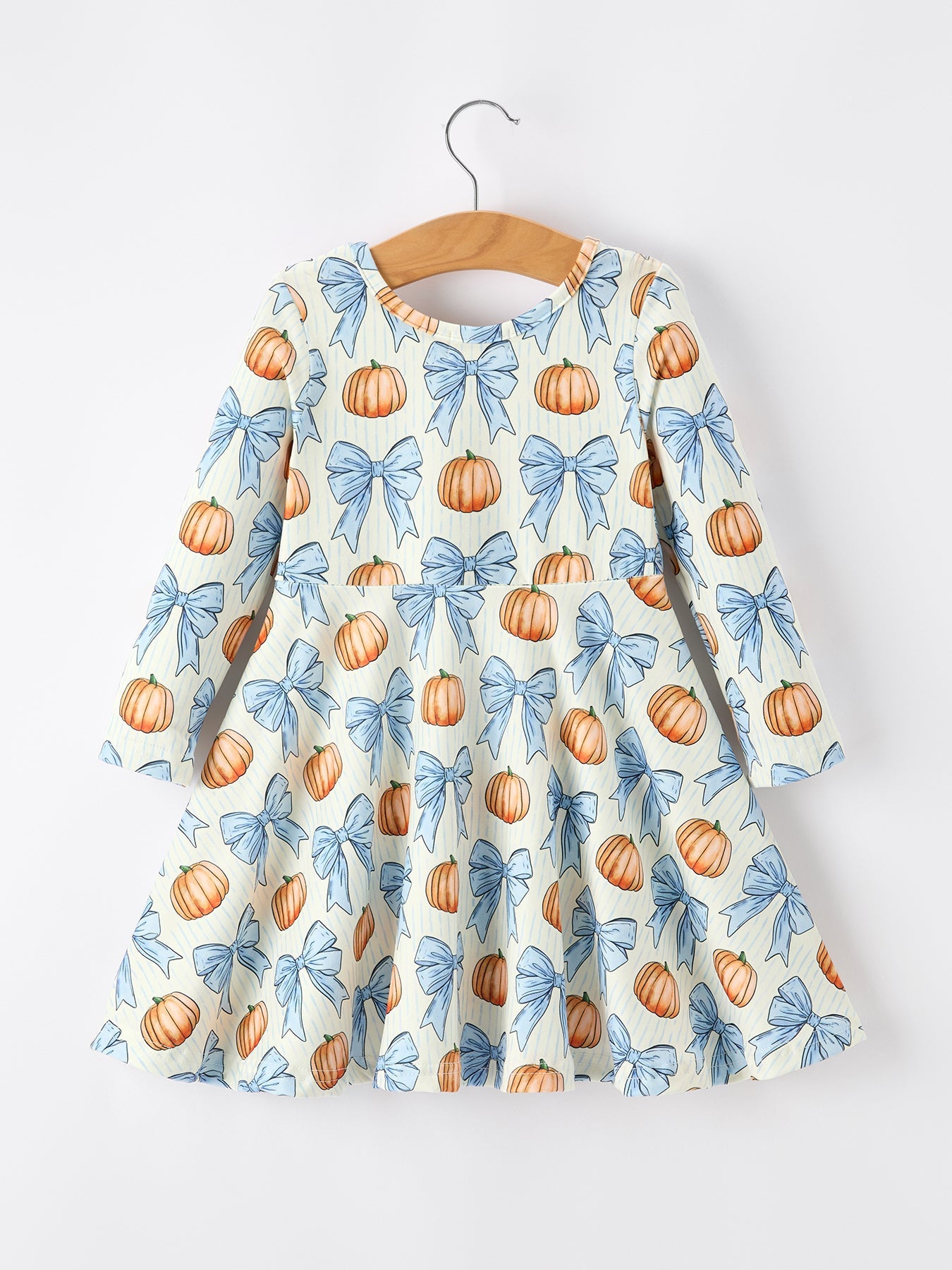 Long sleeve girls dress with a pumpkin and bow print for fall.