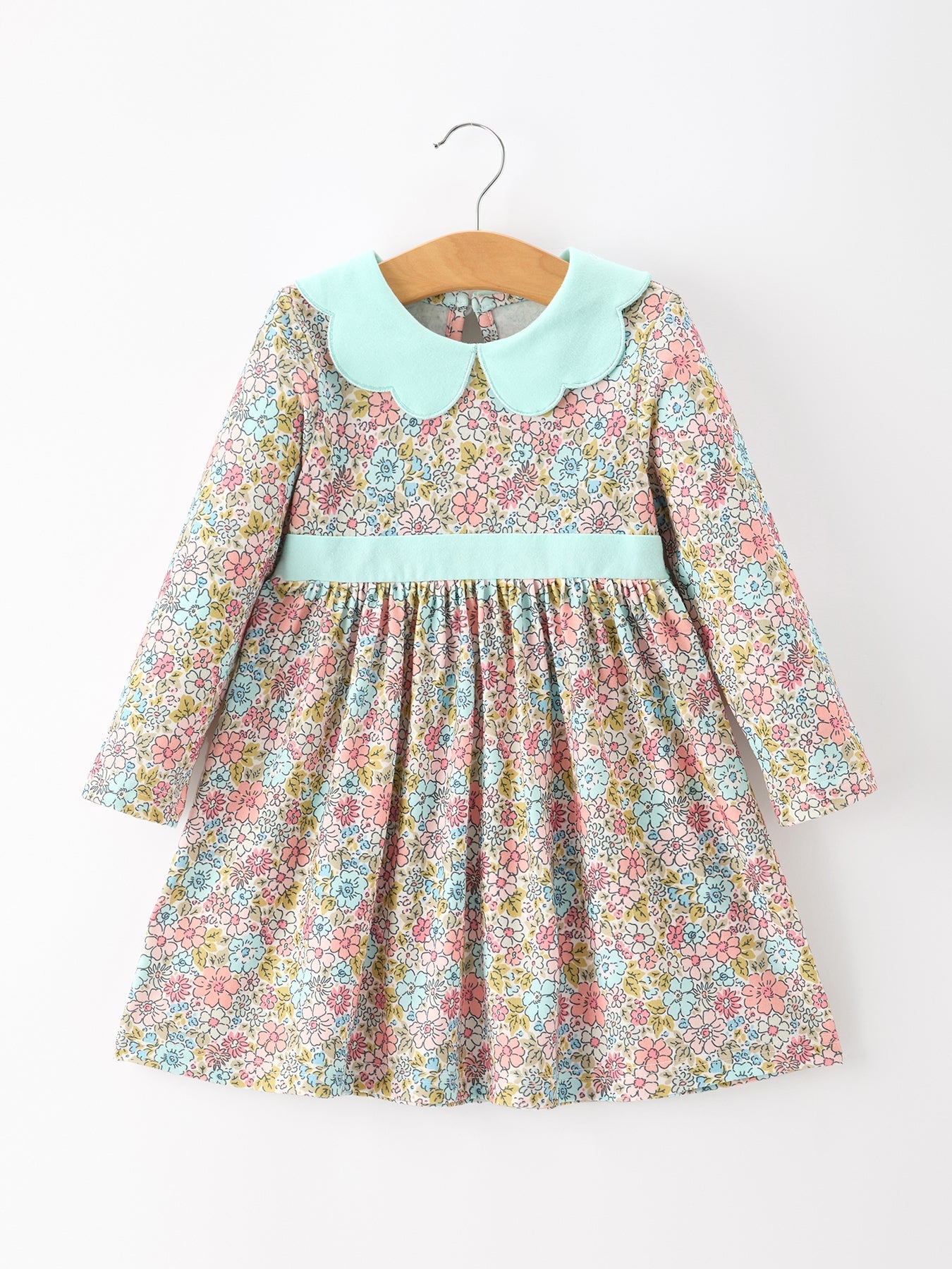Girl's dress with soft pastel floral print, mint petals collar, and a flowy gathered skirt