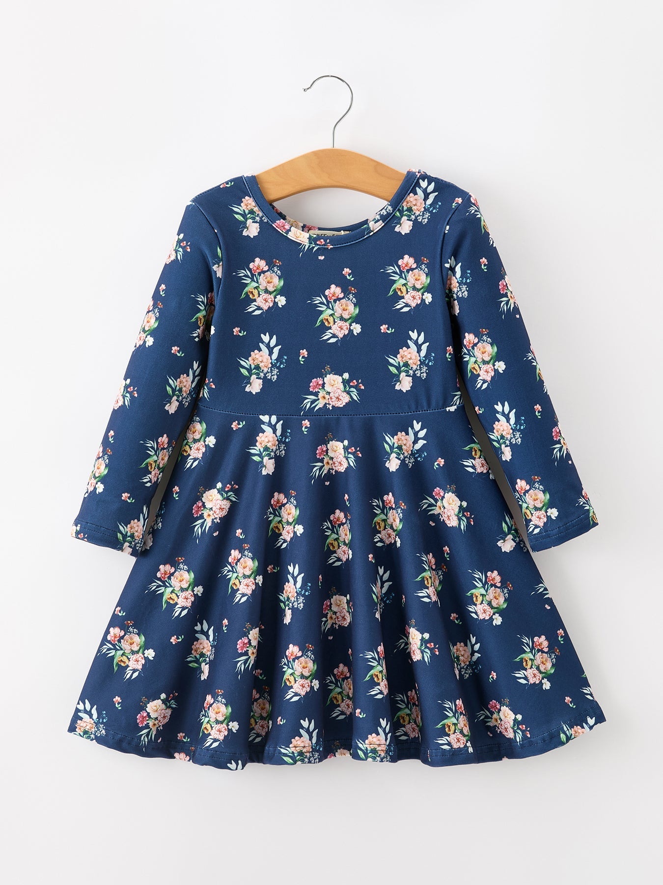 Long sleeve girls dress with navy background and floral bouquets in a full twirl skirt silhouette