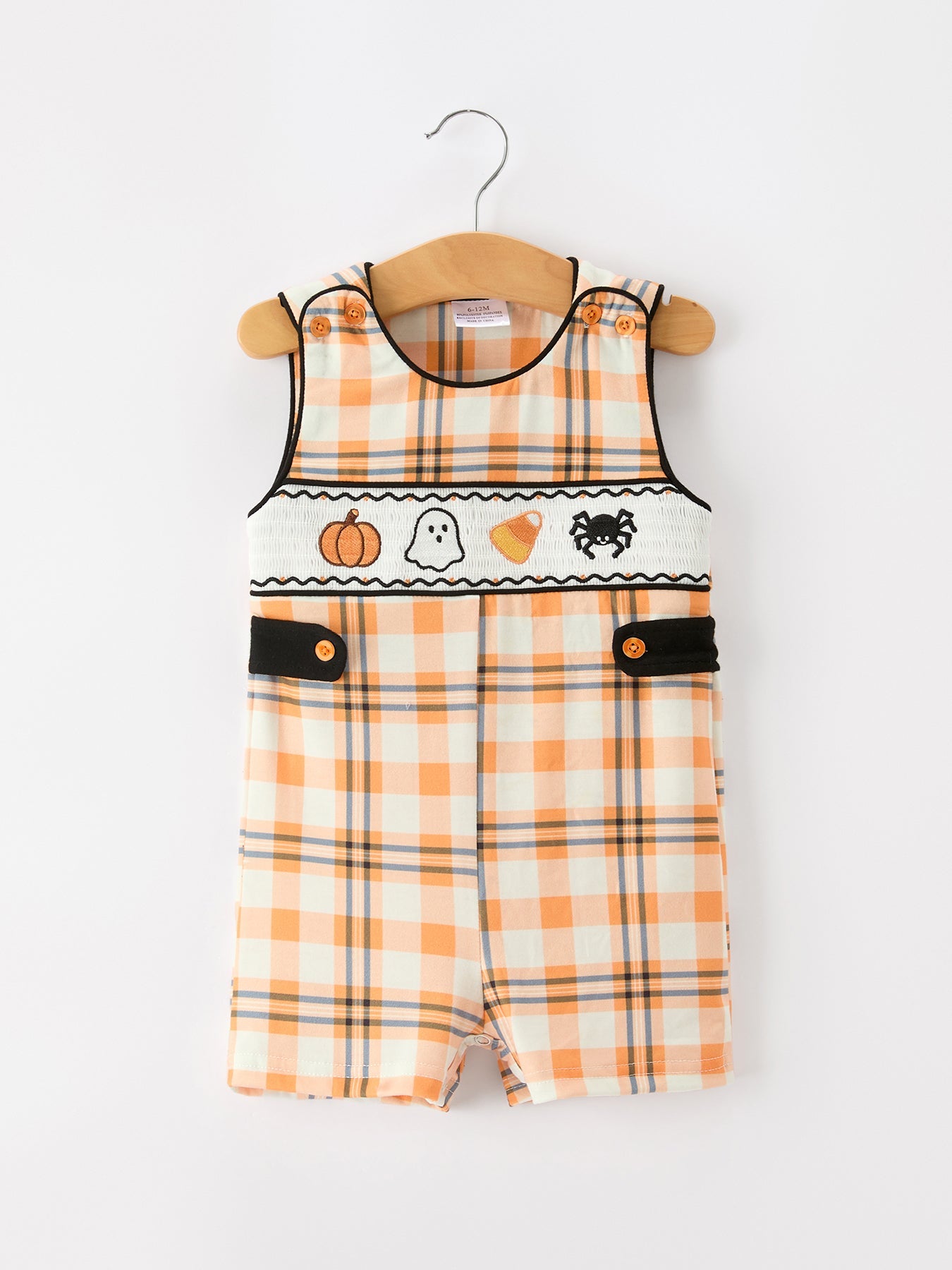 Boys sleeveless JonJon romper in orange plaid with smocked Halloween icons and black trim