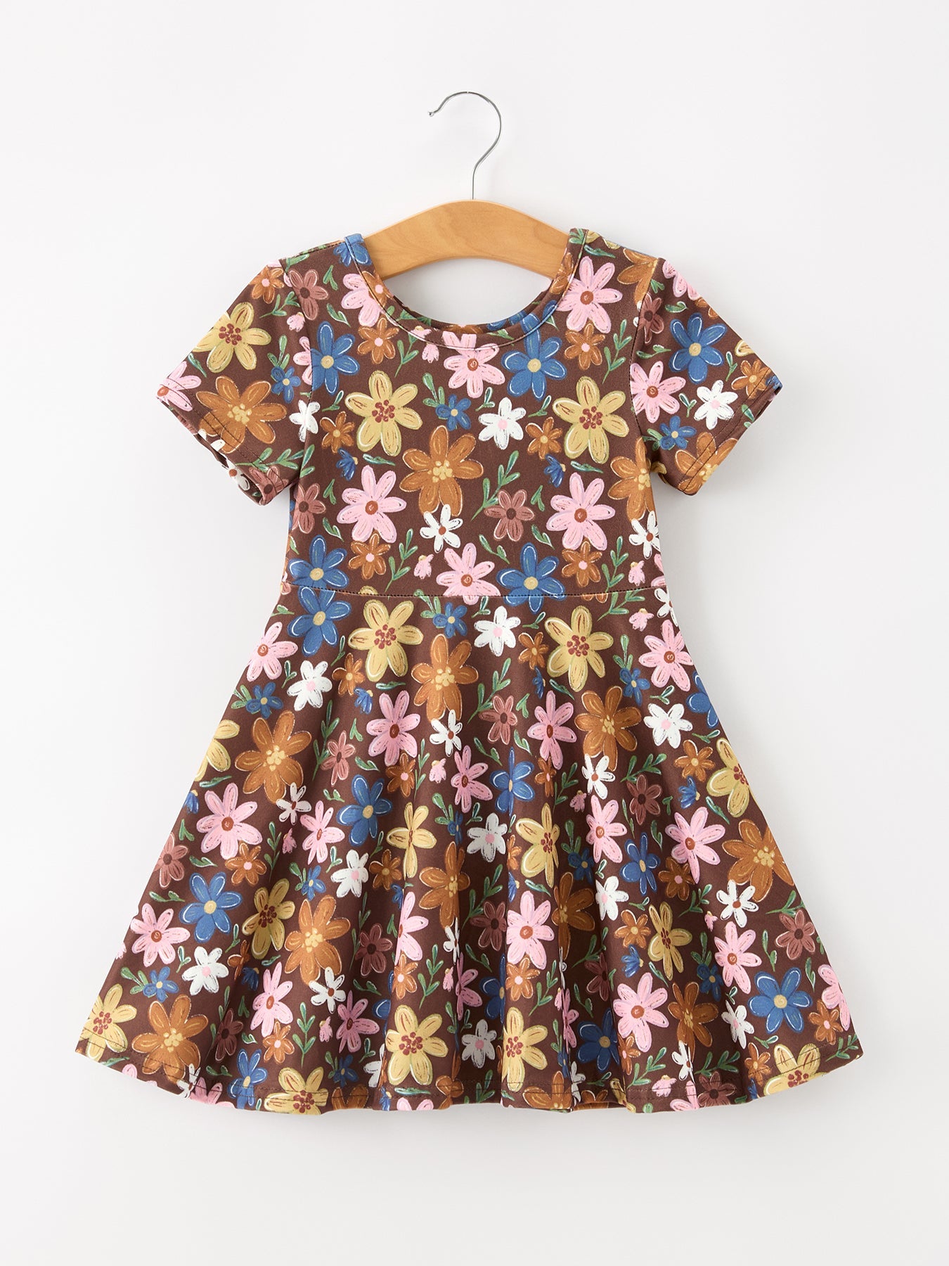 Short sleeve girls dress with colorful retro floral print on a brown background and full twirl skirt.
