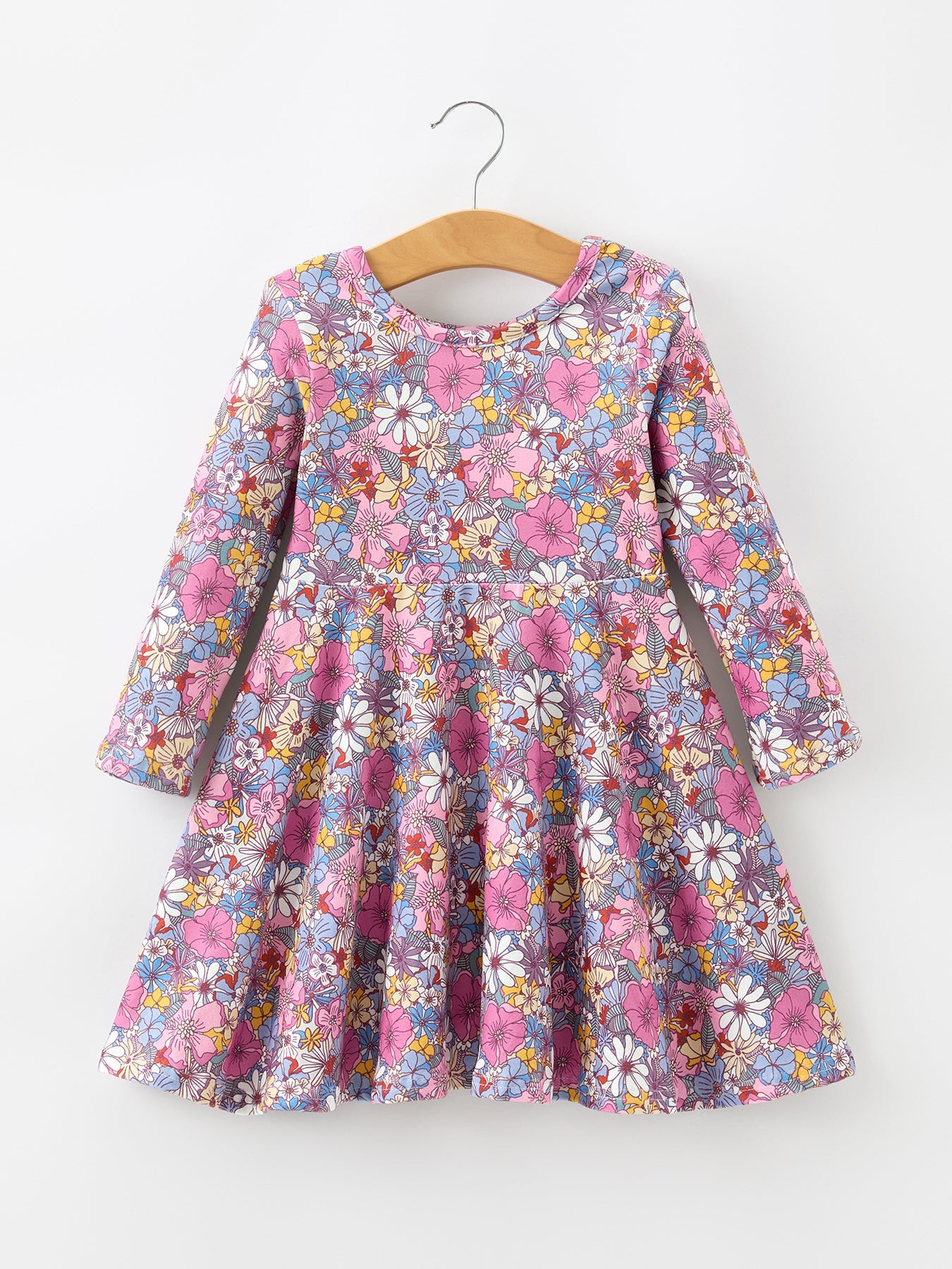 Long sleeve girls twirl dress in a colorful retro floral print with a flowy full skirt