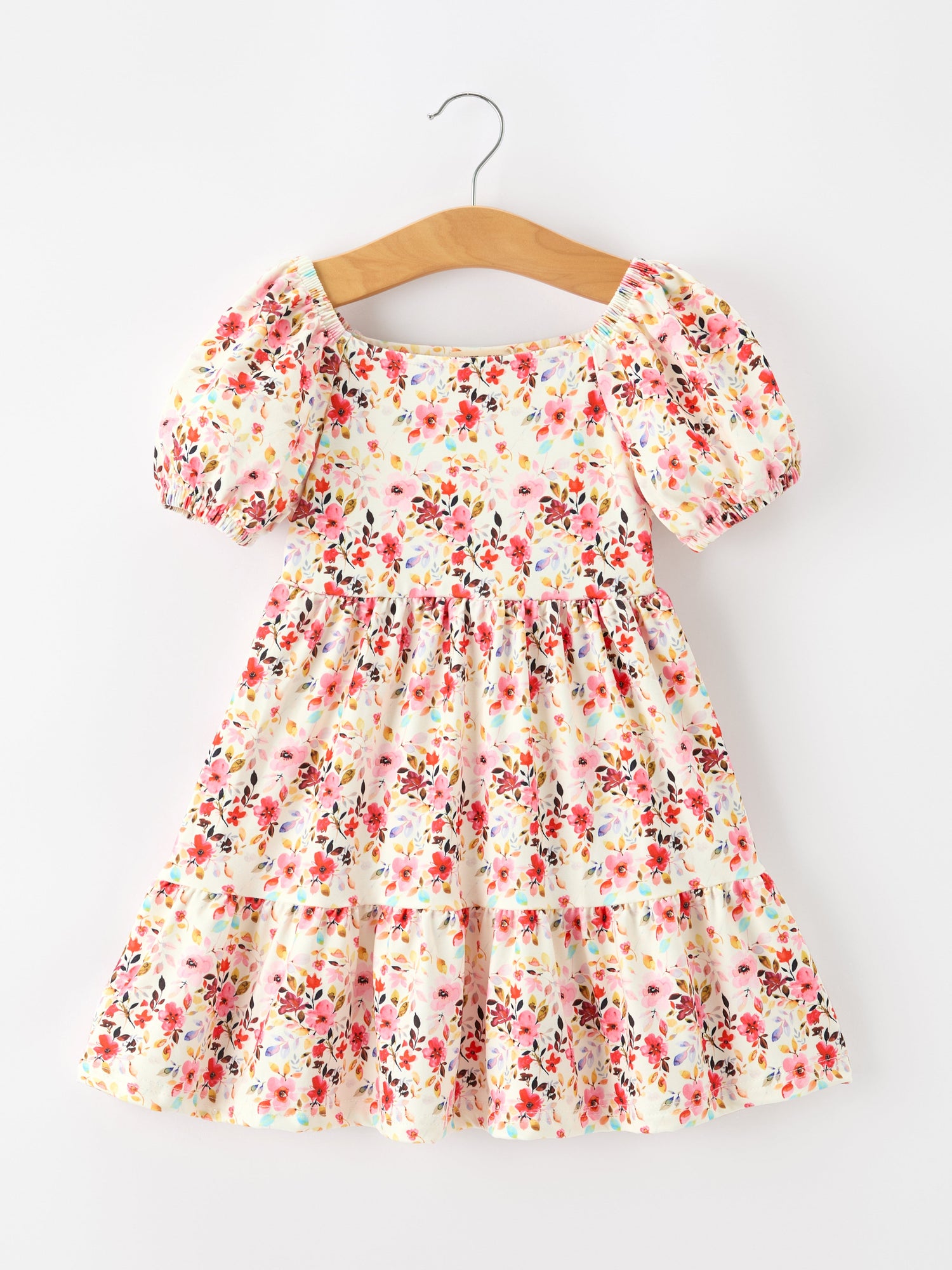 Girls dress with vintage floral print, puff sleeves, square neckline, gathered waist, and flowy skirt.