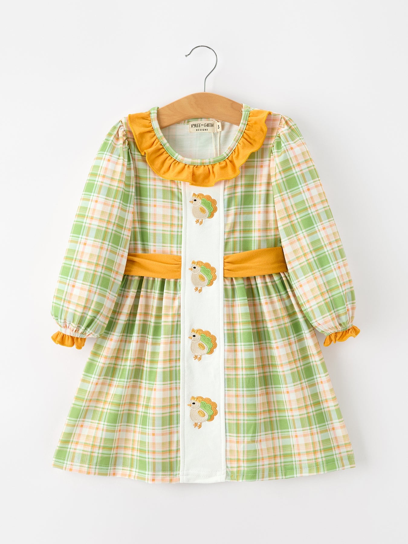 Girls long sleeve plaid dress with a Thanksgiving turkey applique on the front