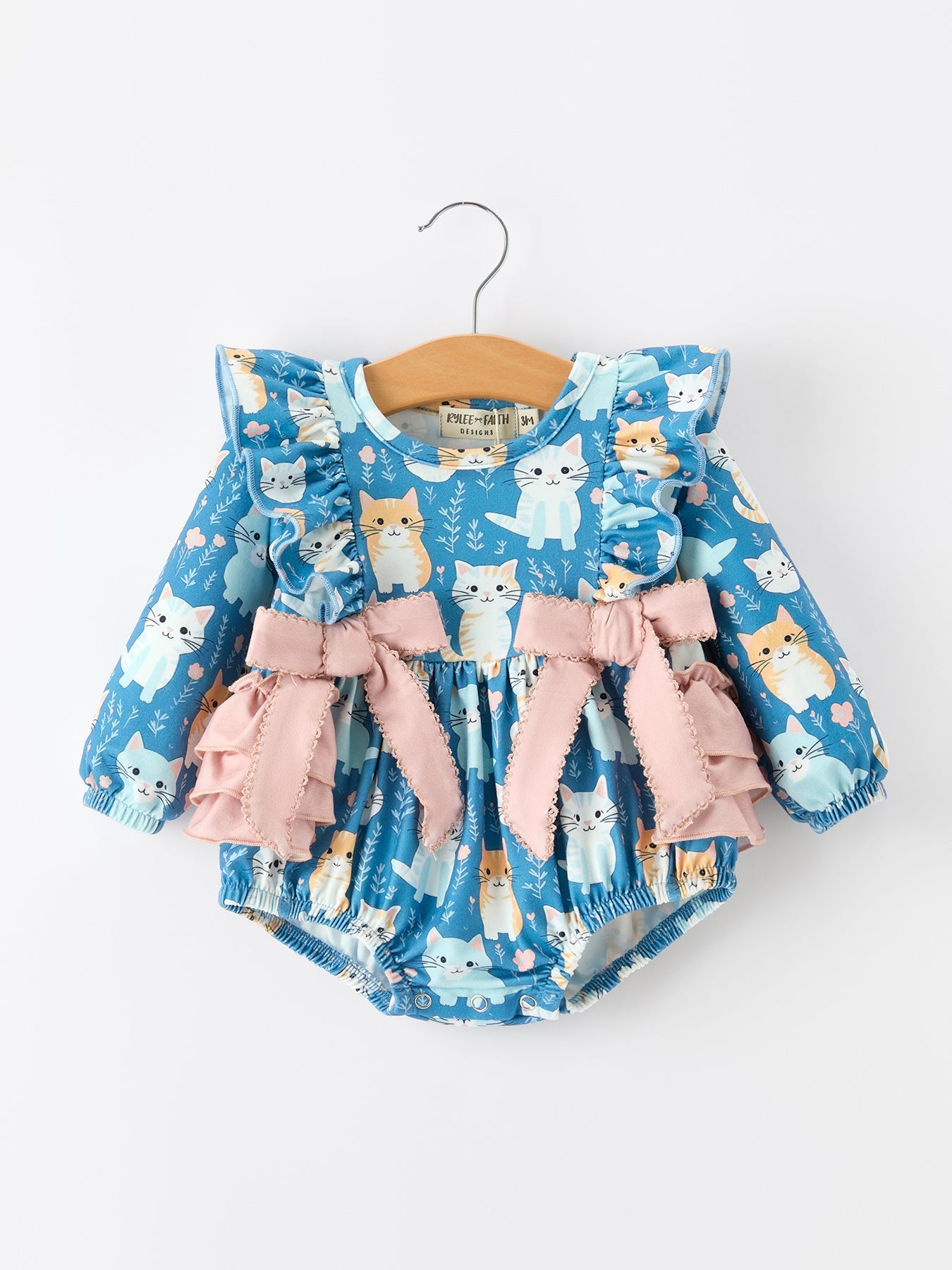 Girls long sleeve romper with an all-over cat print in fall colors.