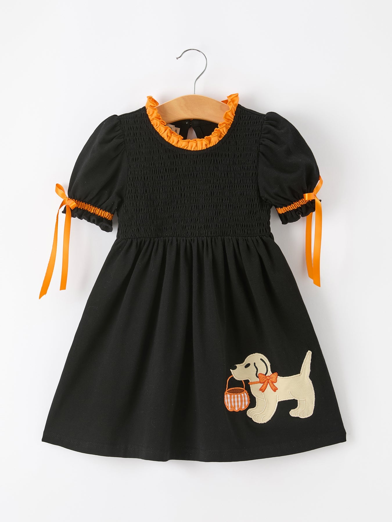 Black girls puff-sleeve dress with bow tie sleeve details and an embroidered dog holding a pumpkin on the skirt