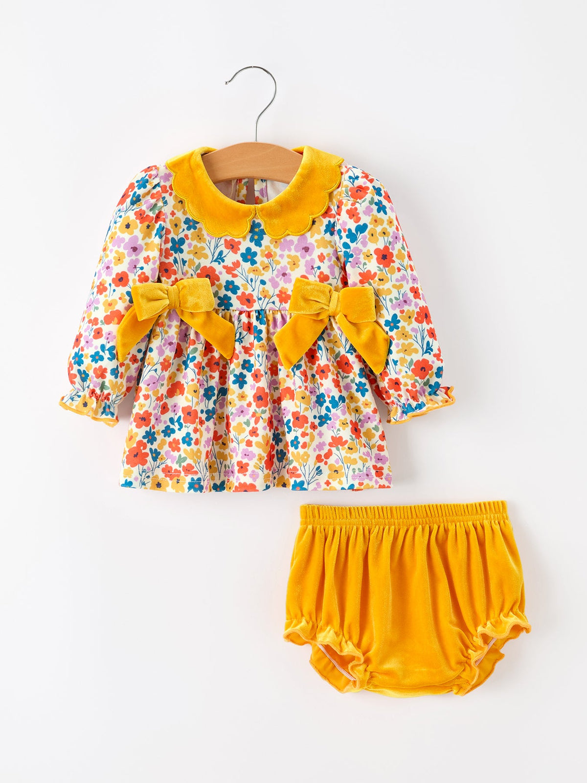 Baby girl outfit set with floral print top, yellow velvet scalloped collar and side bows, and mustard bloomers