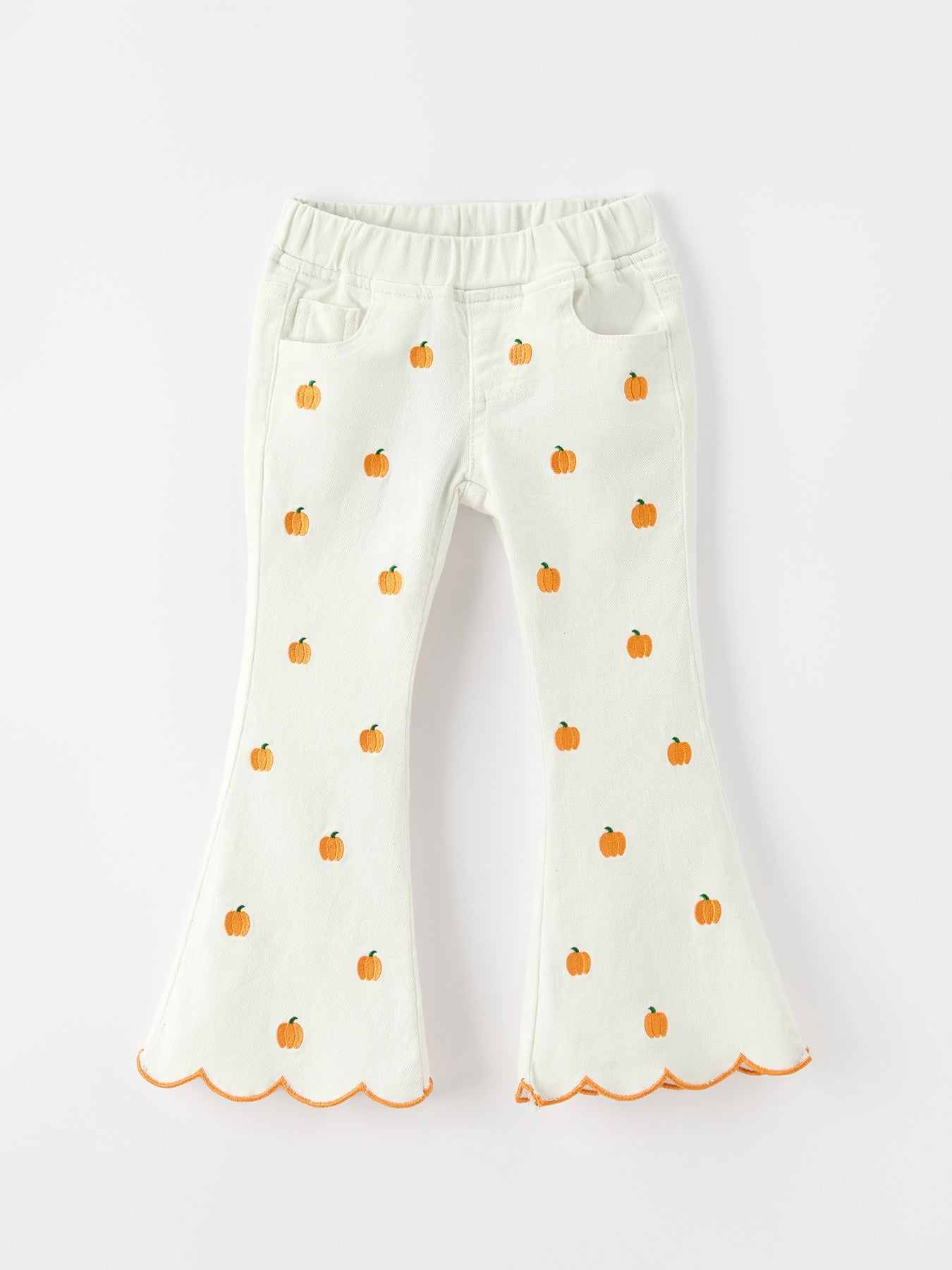 Cream wide-leg girls' pants with all-over orange pumpkin embroidery, elastic waistband and scalloped hem