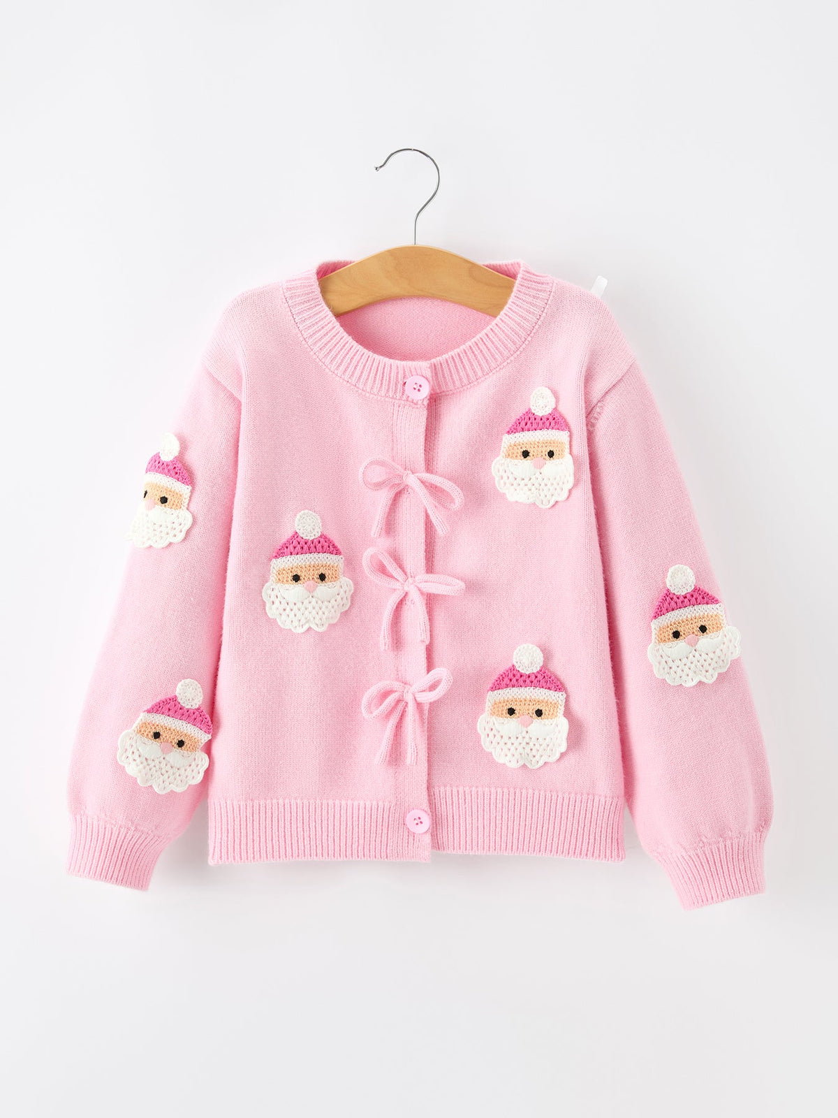 Baby girl pink knit cardigan with Santa face embroidery, front bow tie closures and ribbed cuffs and hem