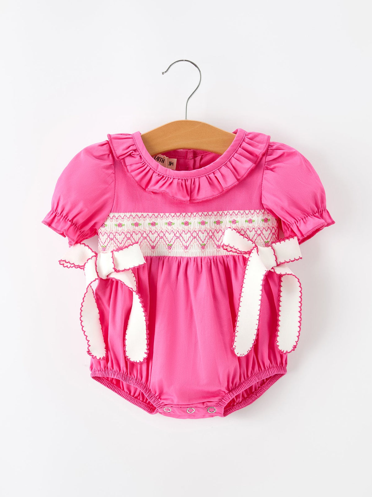 Baby girl romper with smocked embroidery bodice and ruffles