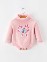 Baby girls knit romper with candy cane inspired design, bow detail at the neck, turtleneck collar and long sleeves