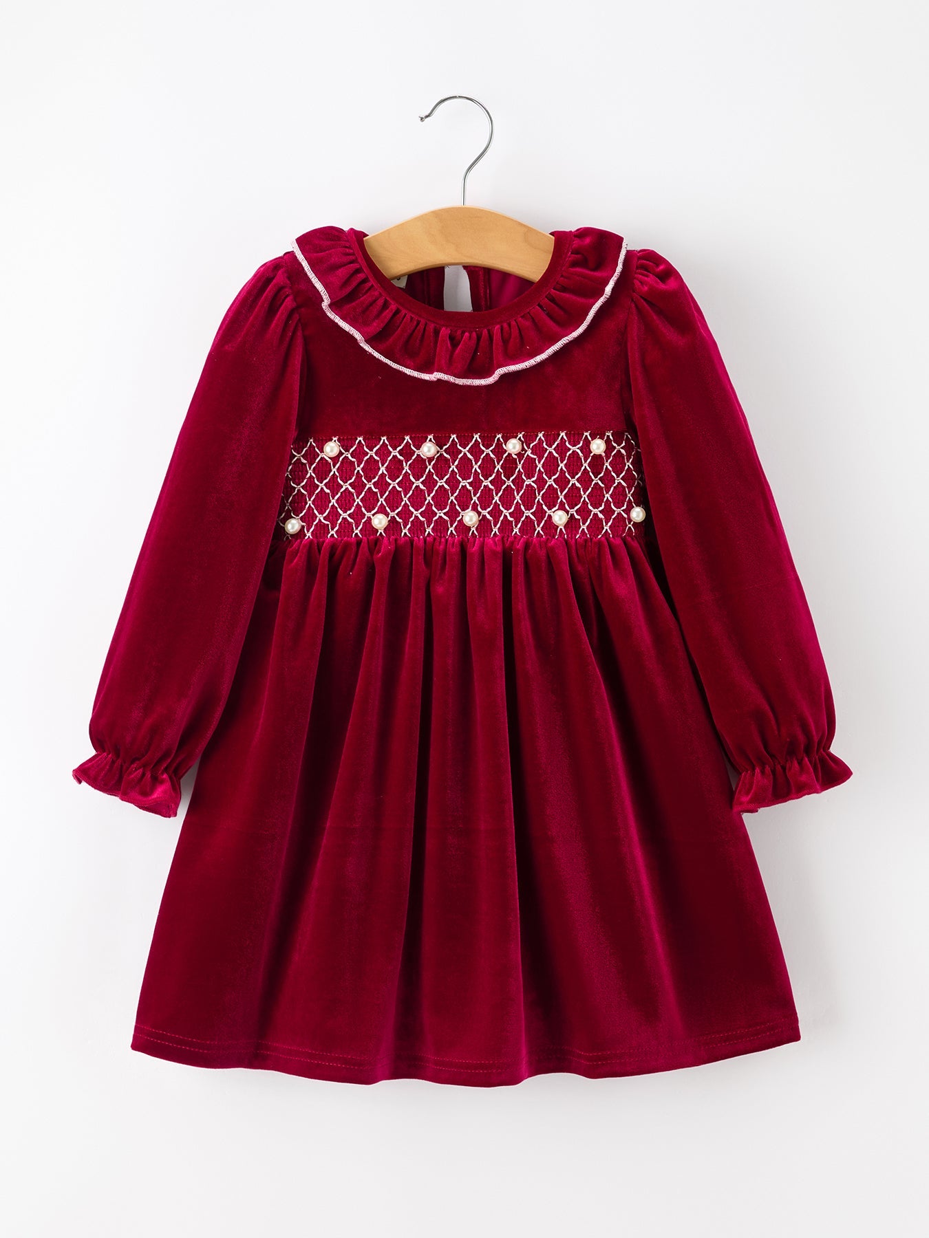 Burgundy velvet girls dress with ruffle neckline, long puff sleeves, smocked waist with pearl accents and full twirl skirt