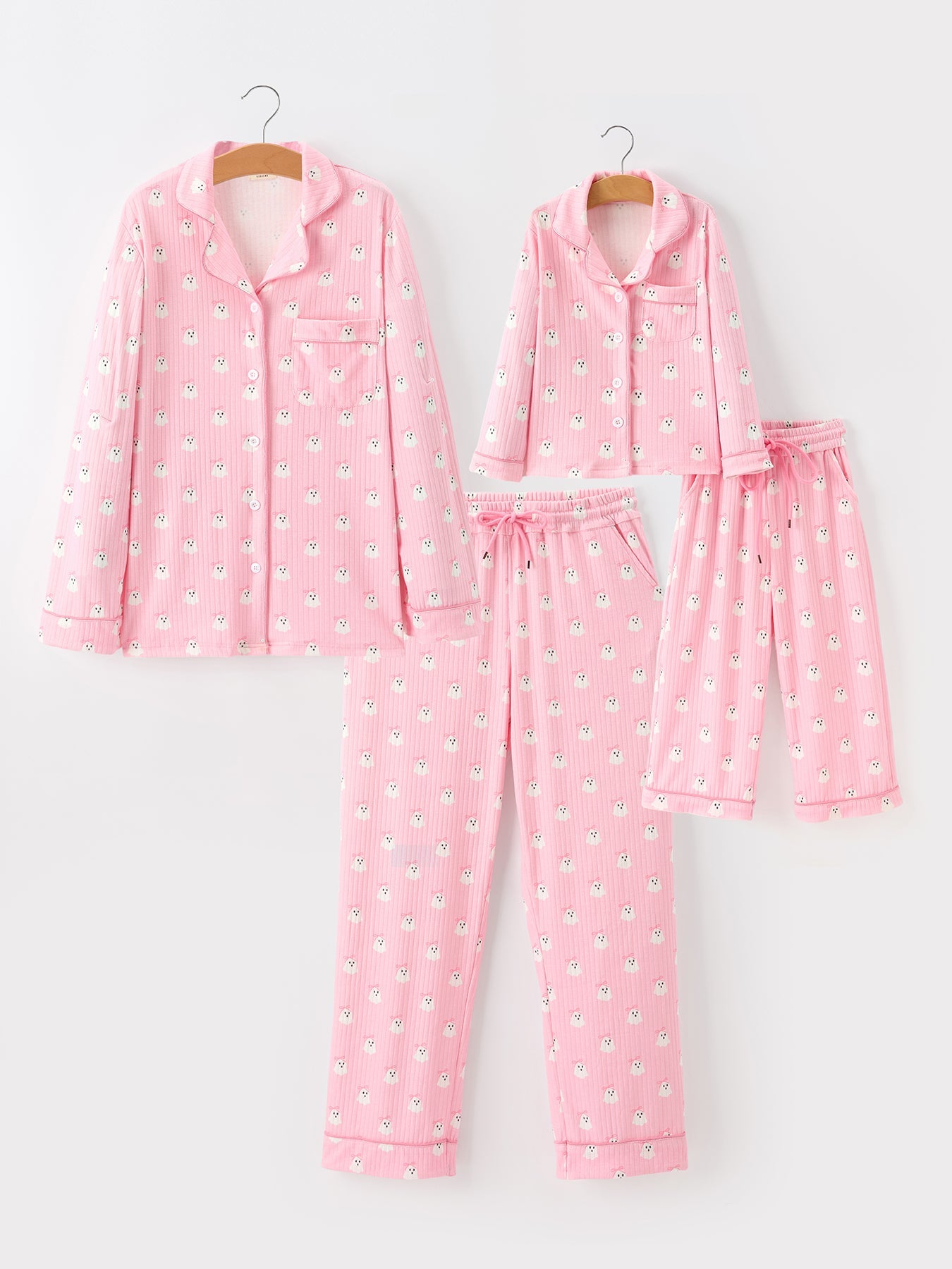 Matching mommy and me pajama set with white ghost print on a dark background, adult and child sizes