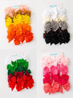 Set of grosgrain bow hair clips on alligator clips shown in assorted color mixes