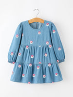 Girls denim dress with allover Santa embroidery, long sleeves with elastic cuffs, round neckline and gathered skirt