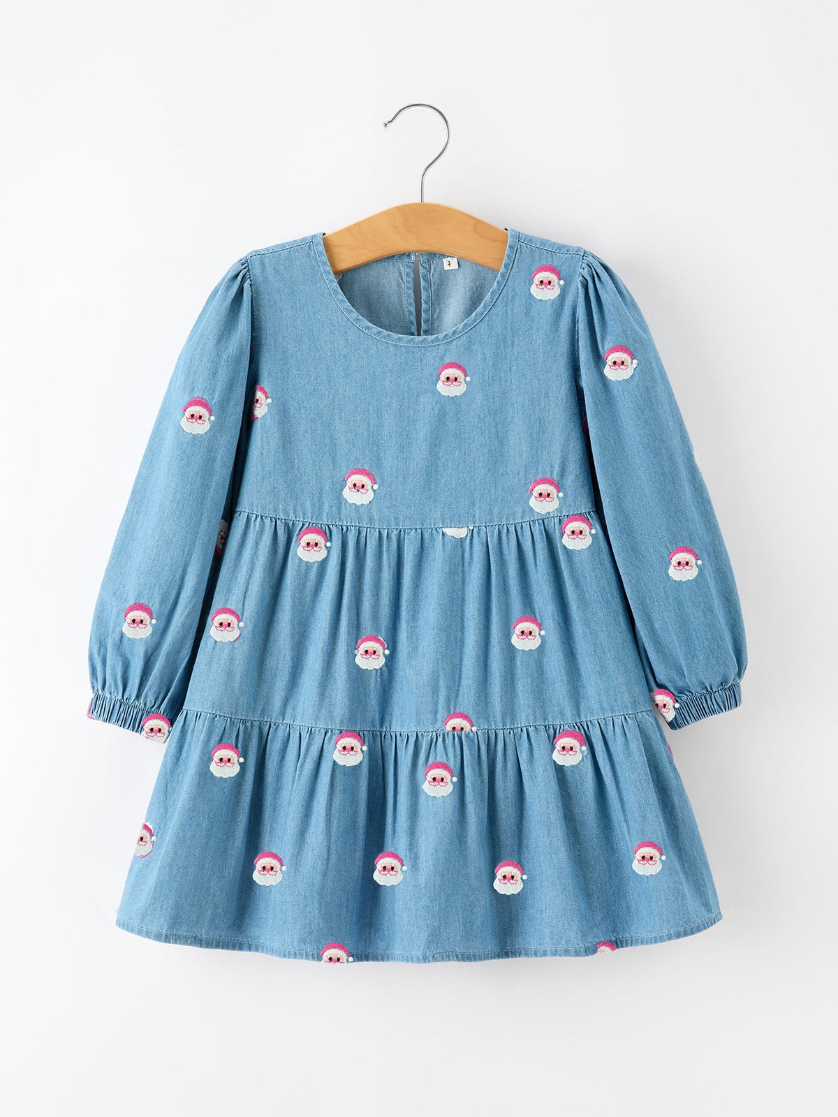 Girls denim dress with allover Santa embroidery, long sleeves with elastic cuffs, round neckline and gathered skirt